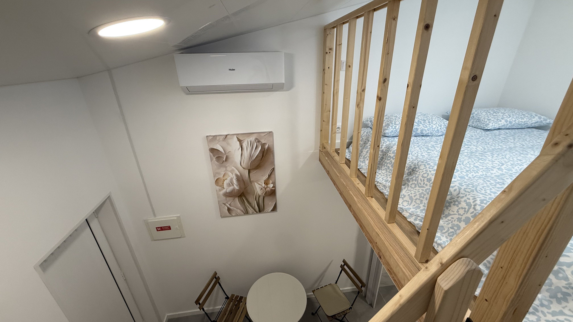 Loft bedroom seating area below