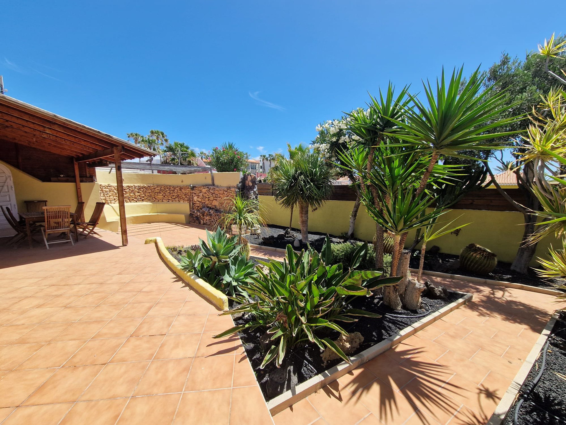 Tiled terrace with tropical garden