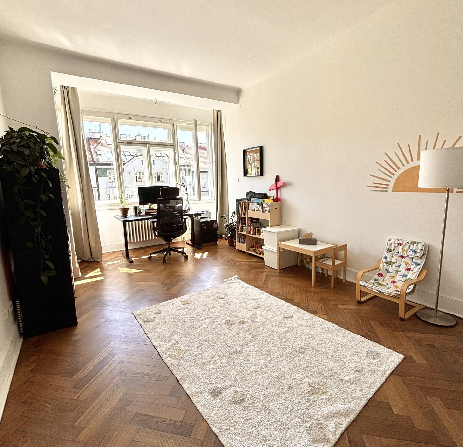Spacious room with desk and play area