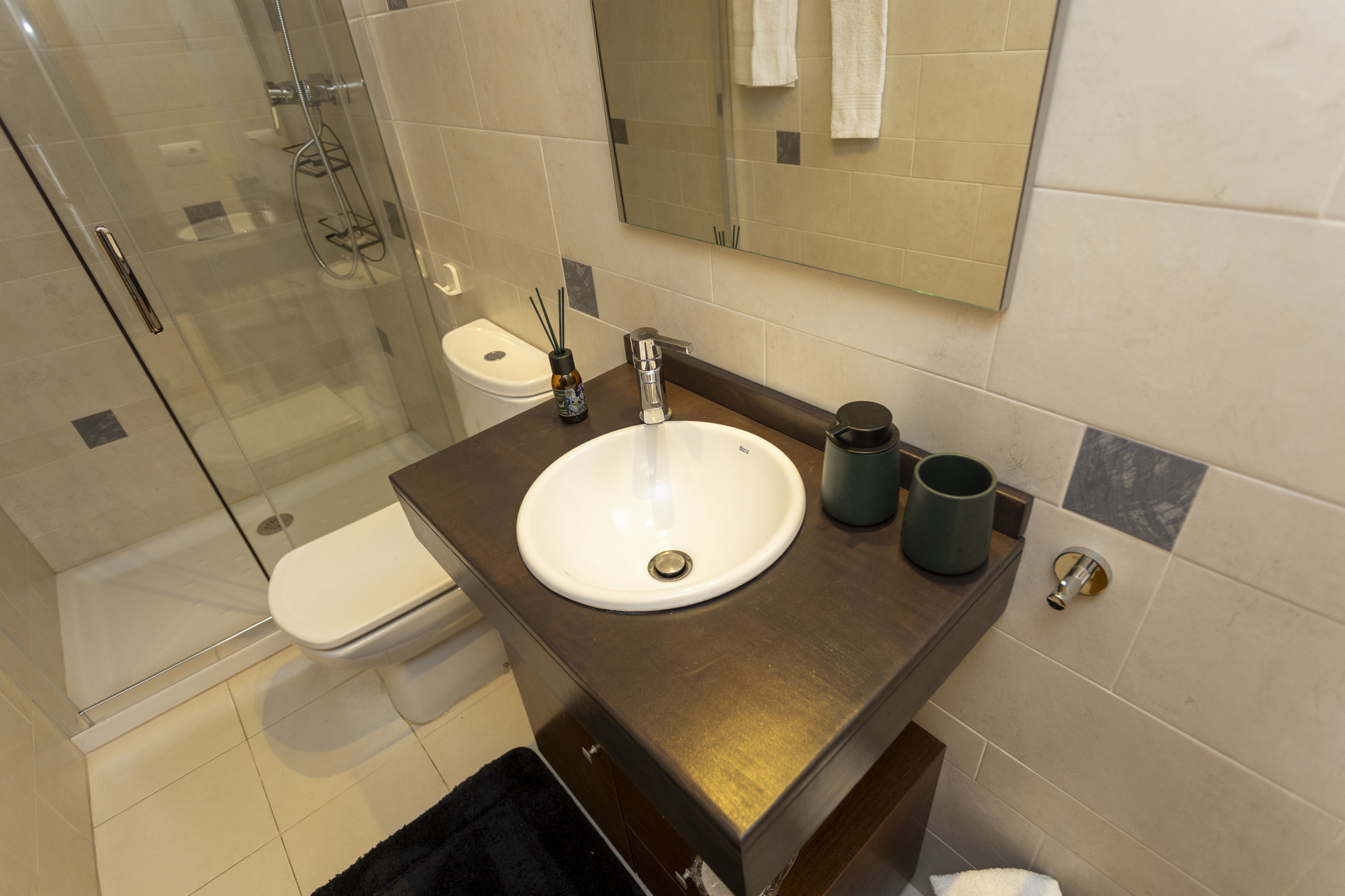 Bathroom with shower and vanity