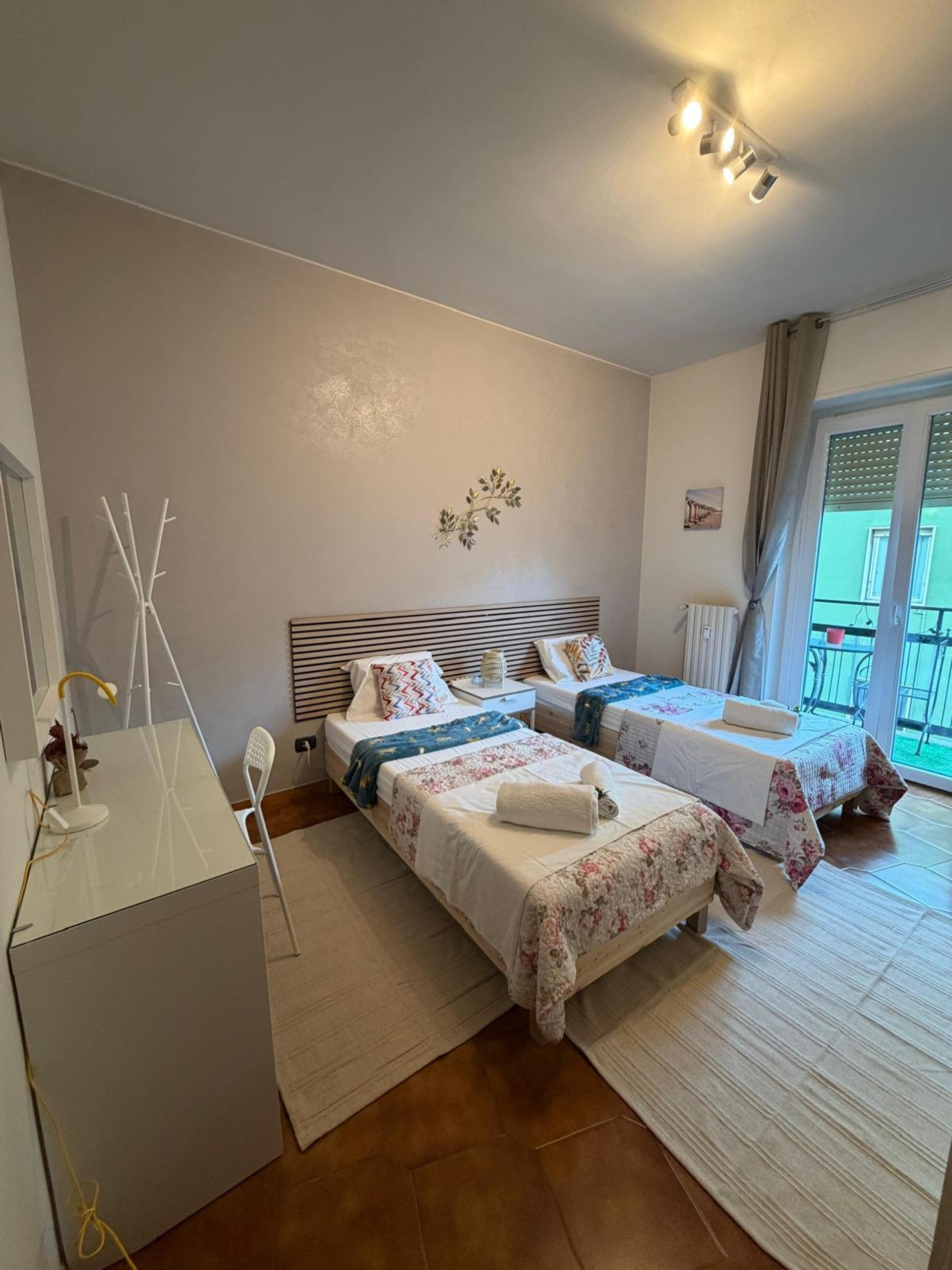 Twin bedroom with balcony access