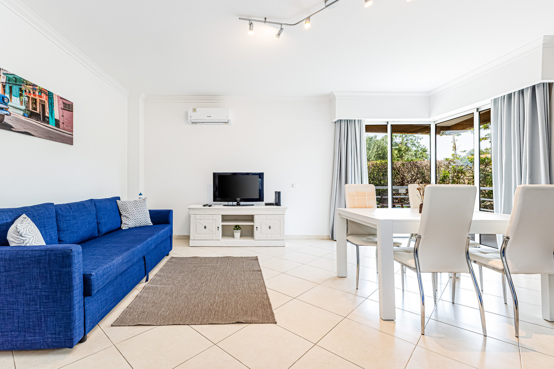 Spacious living room with dining set