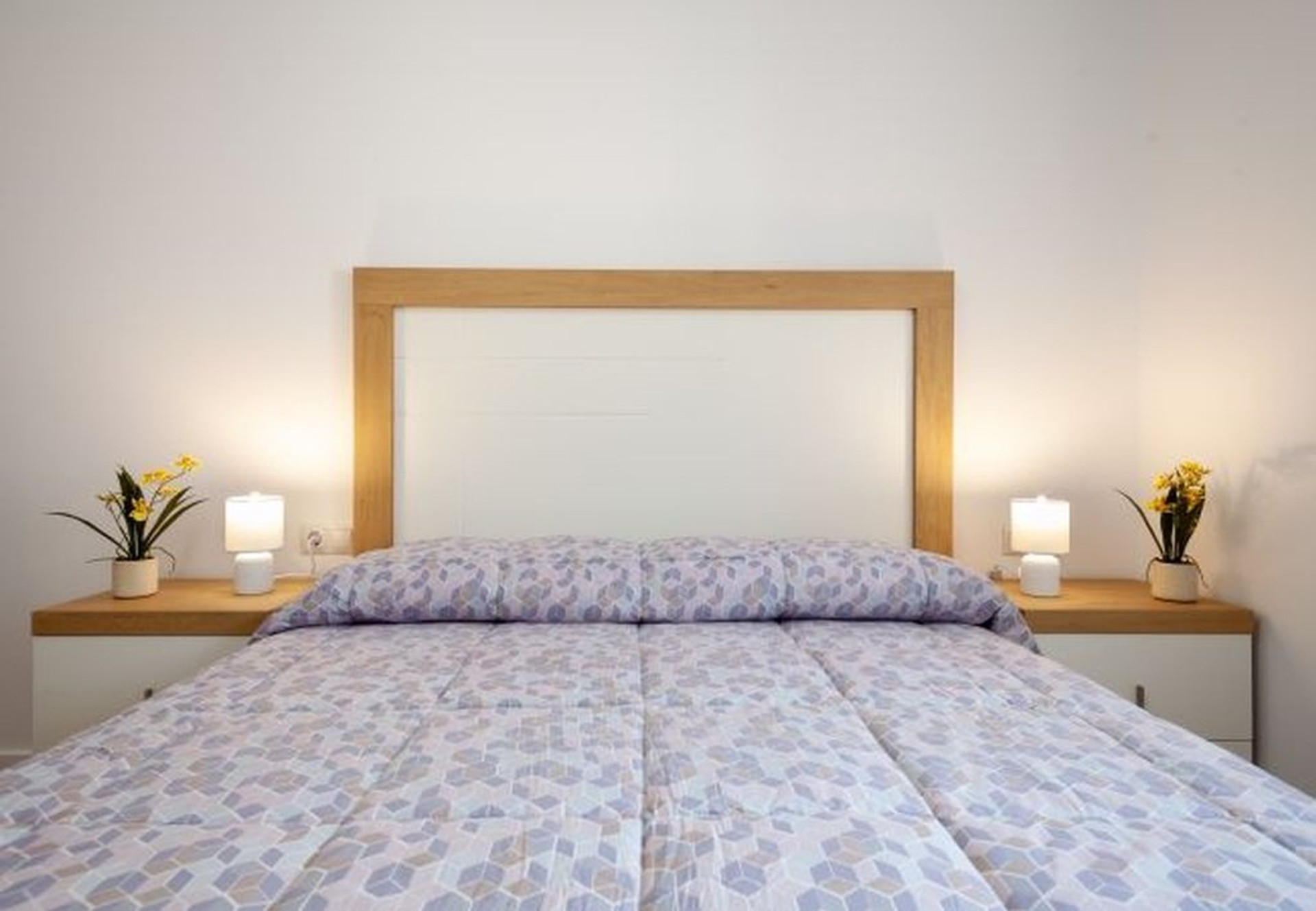 Bedroom with wooden headboard