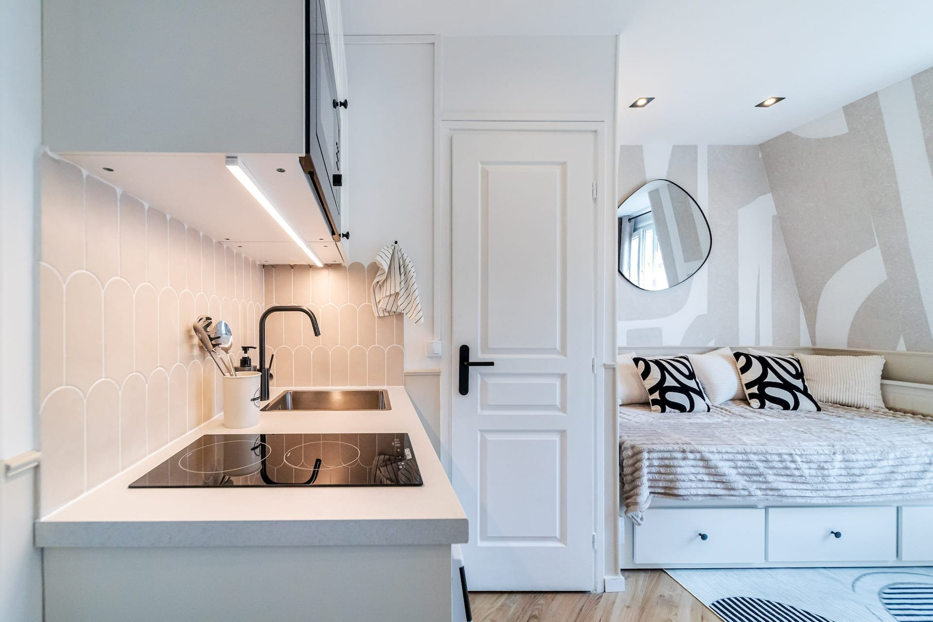 Kitchen sink view into bedroom