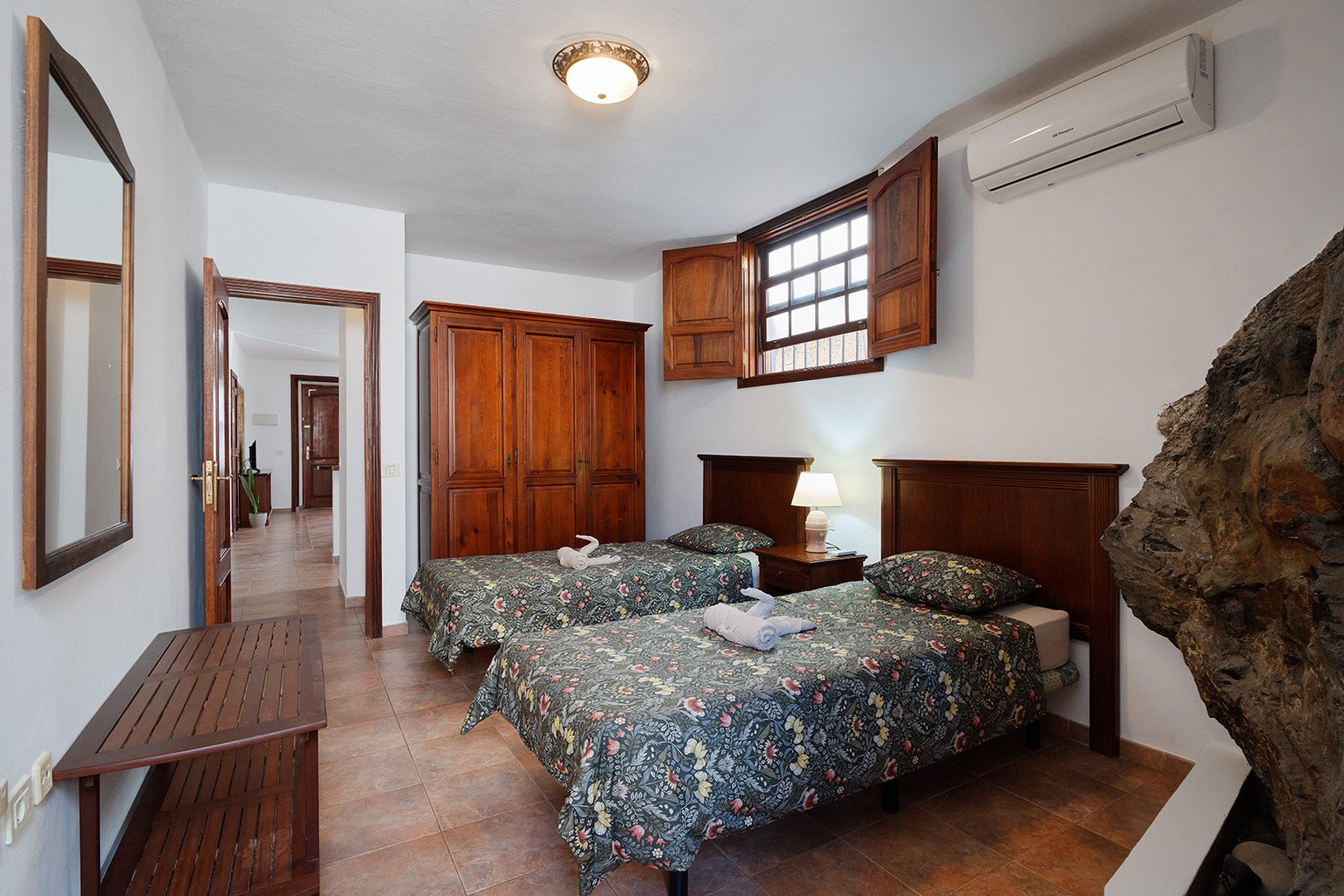 Twin bedroom with wooden wardrobe