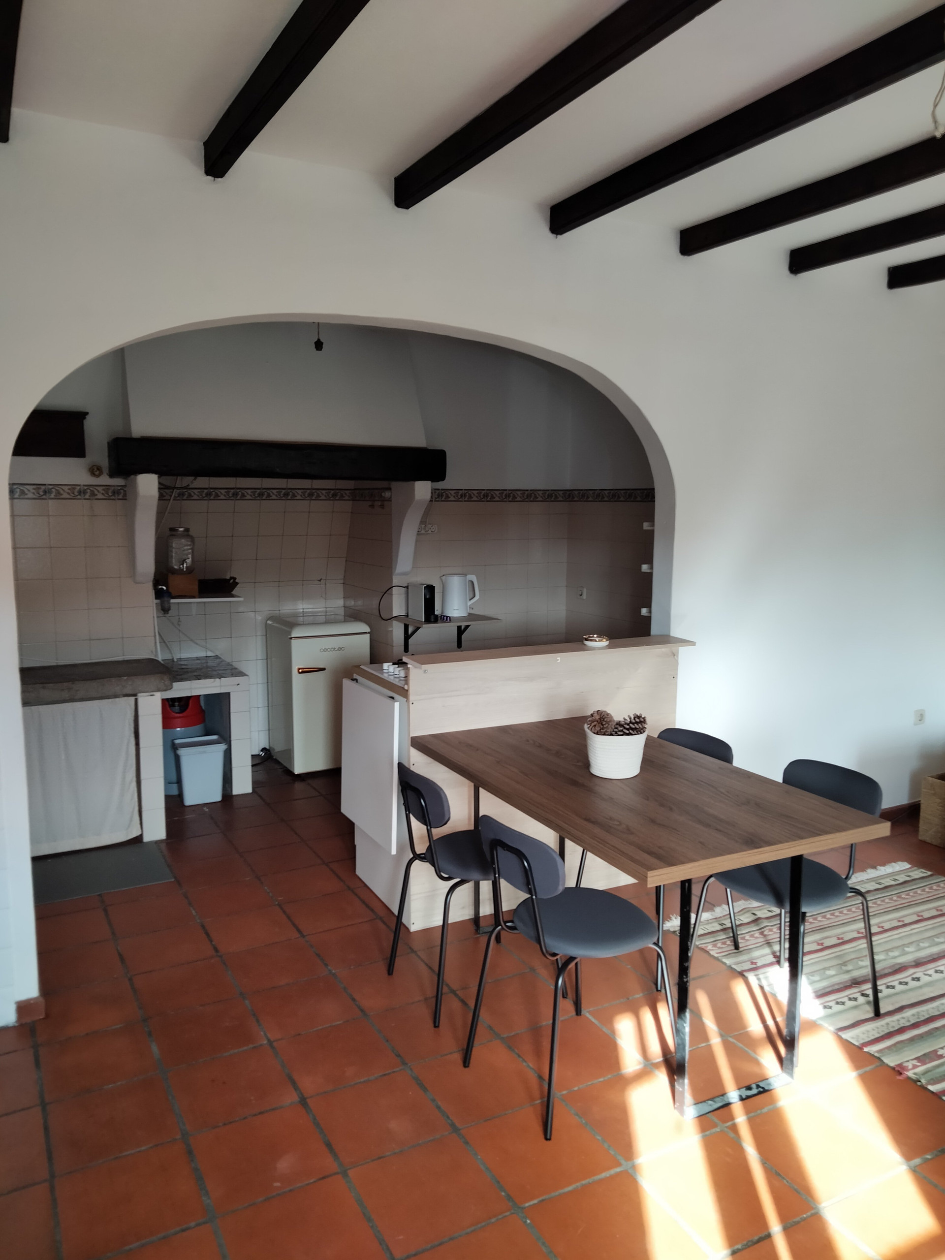 Dining area with kitchen archway