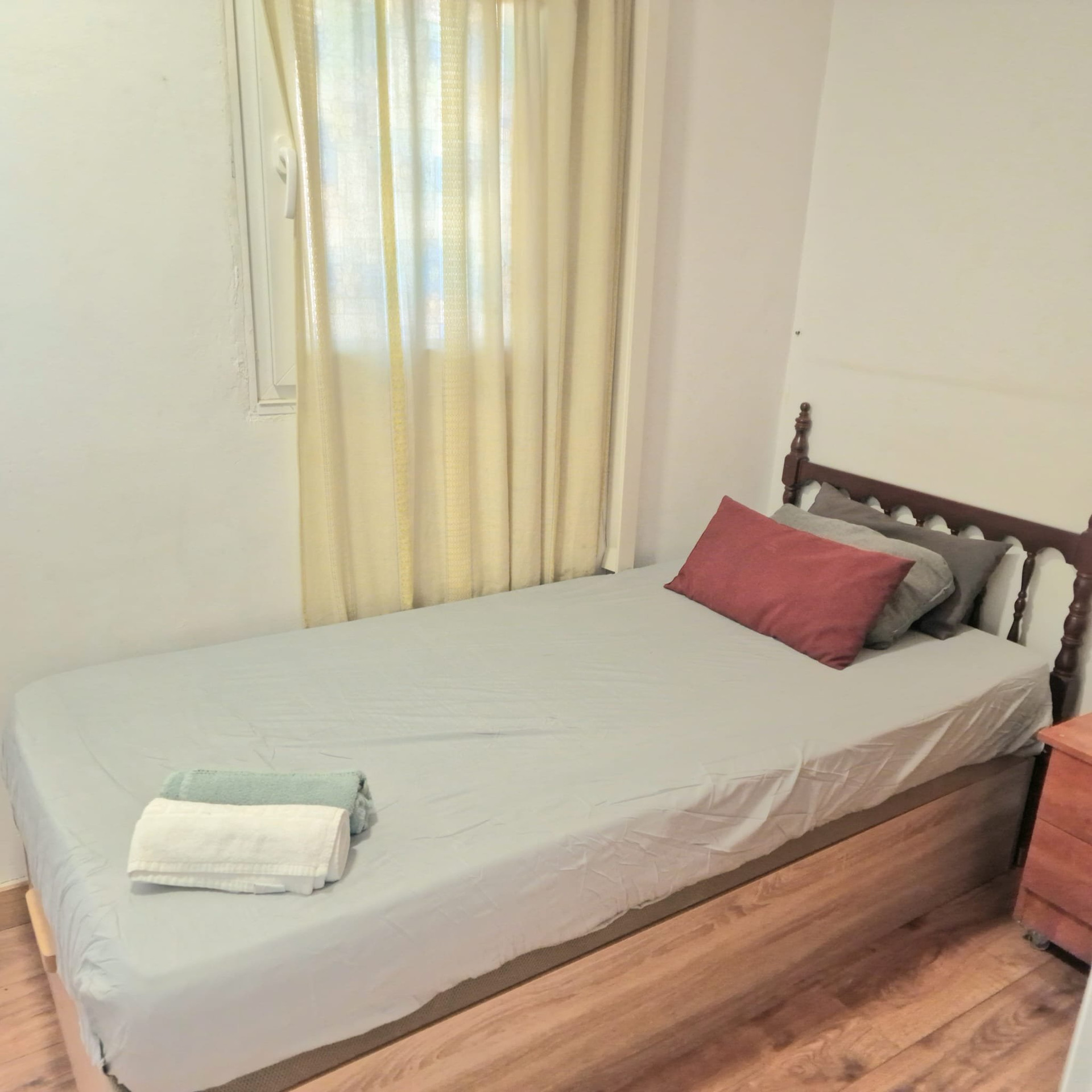 Single bed by window