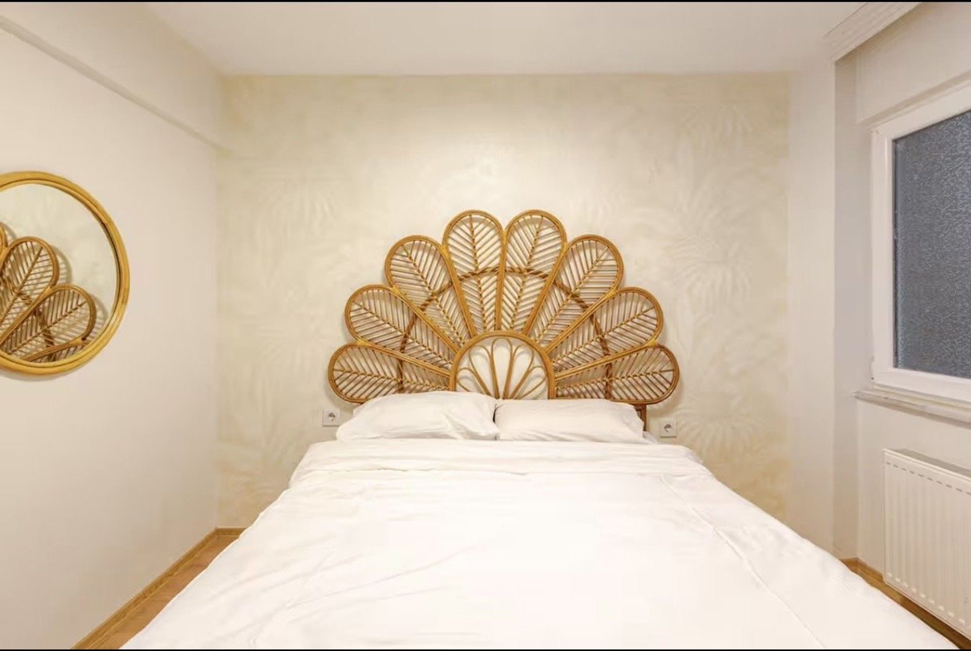 Bedroom with rattan headboard bed