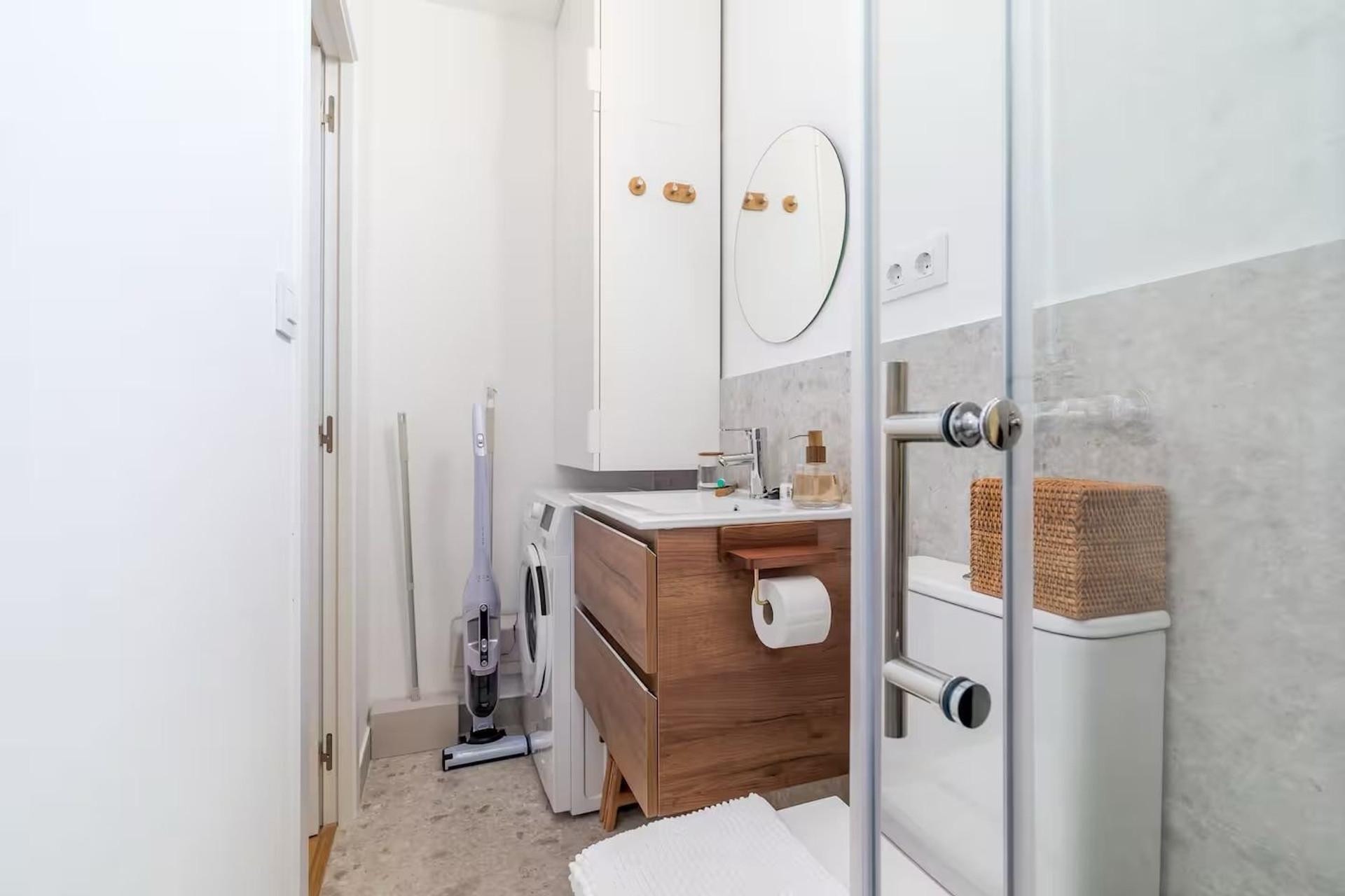 Bathroom with wooden vanity unit