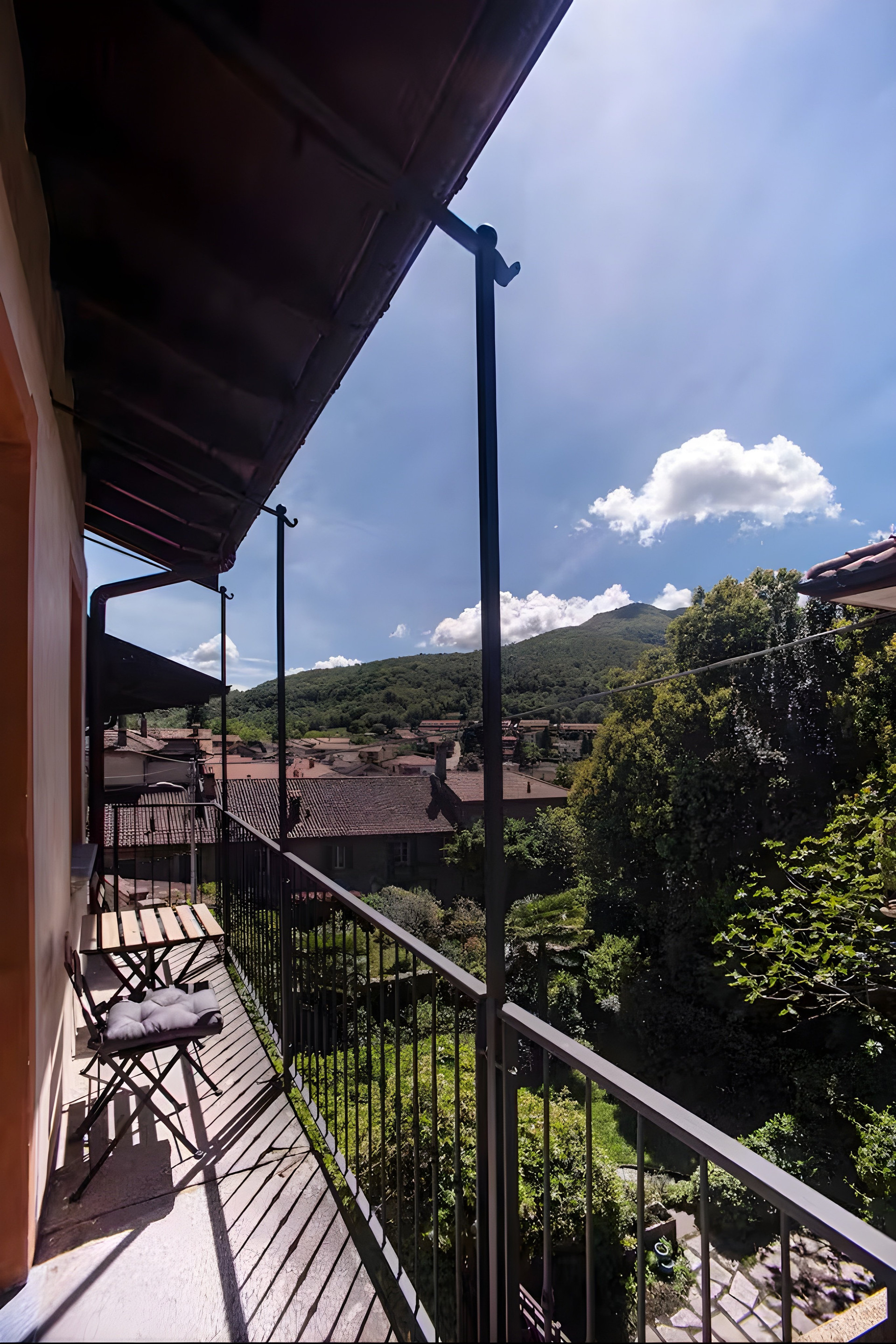 Balcony with mountain village view
