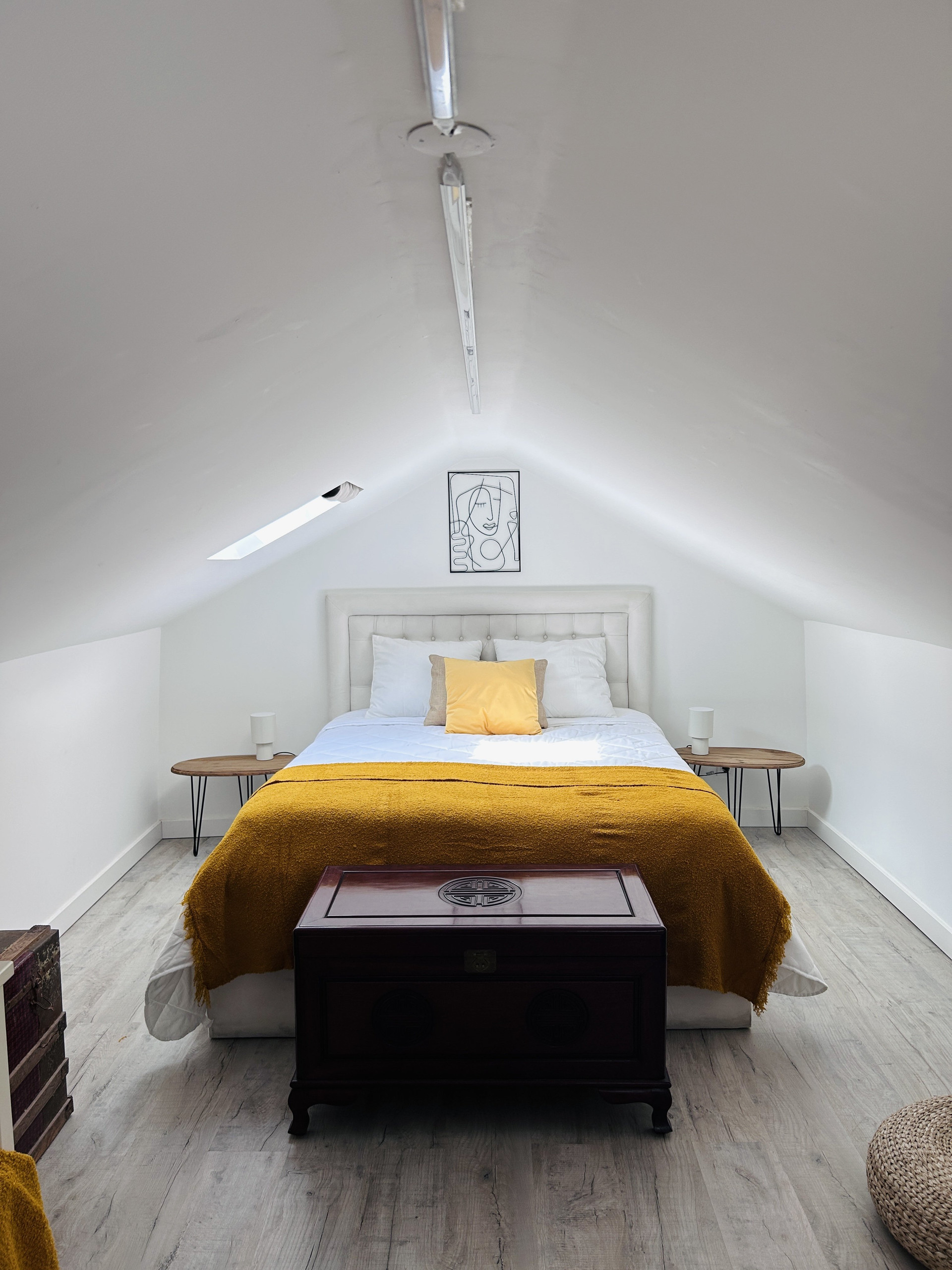 The double bed, in the sleeping room