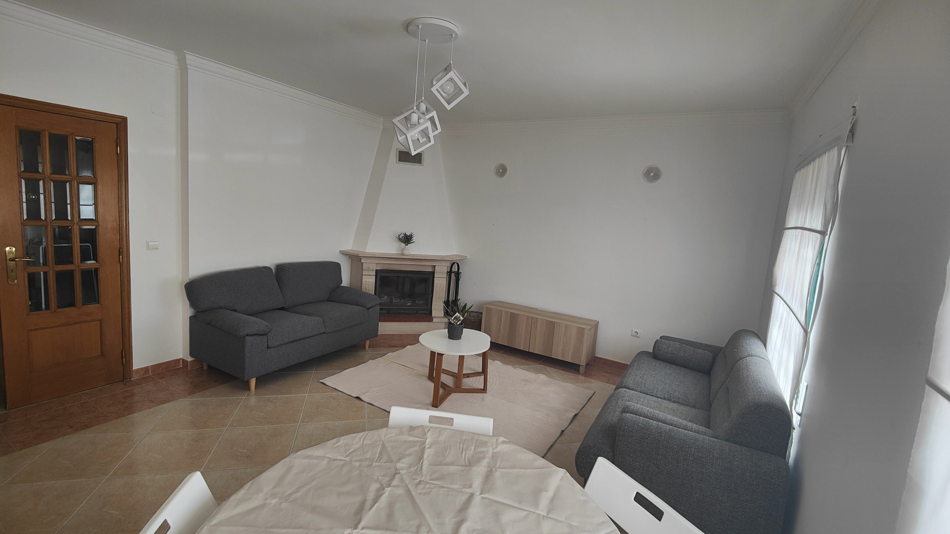 Living room with fireplace and sofas