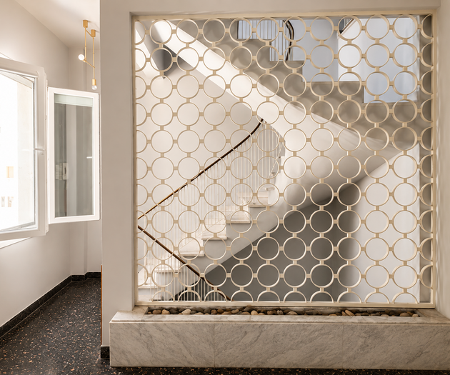 Hallway with decorative stair screen