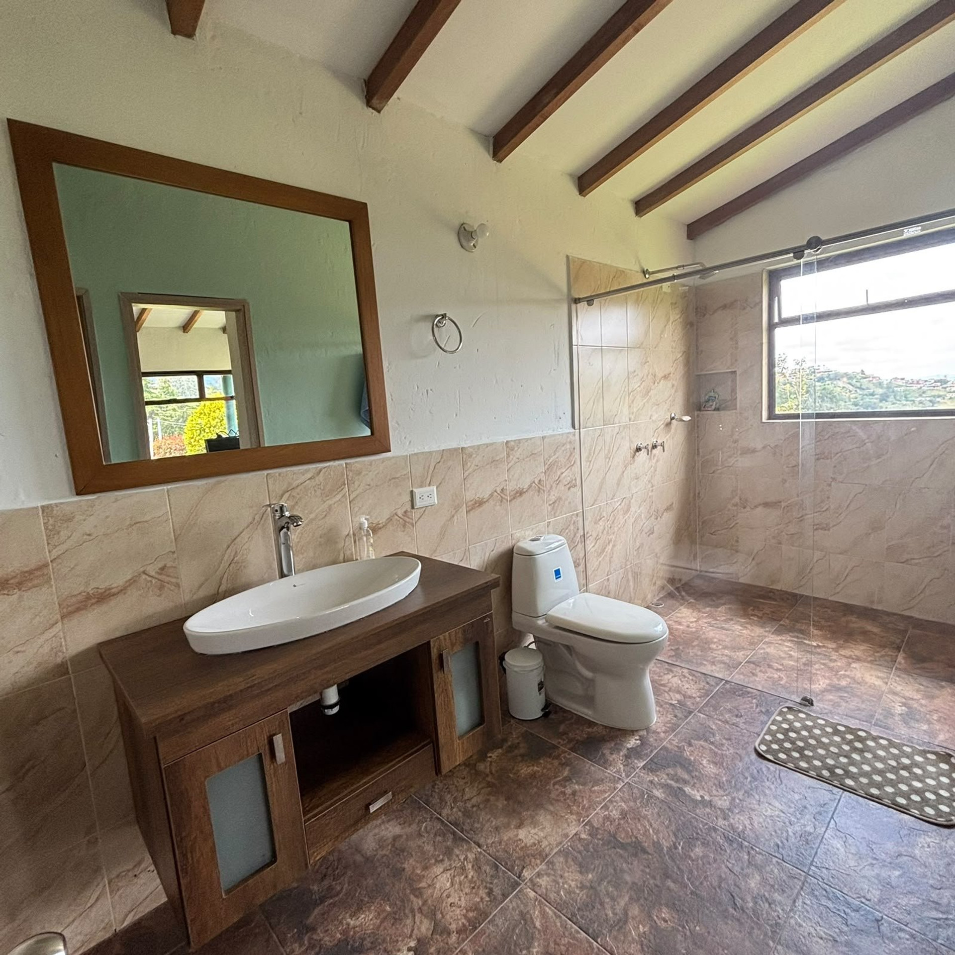 Bathroom with large vanity and shower