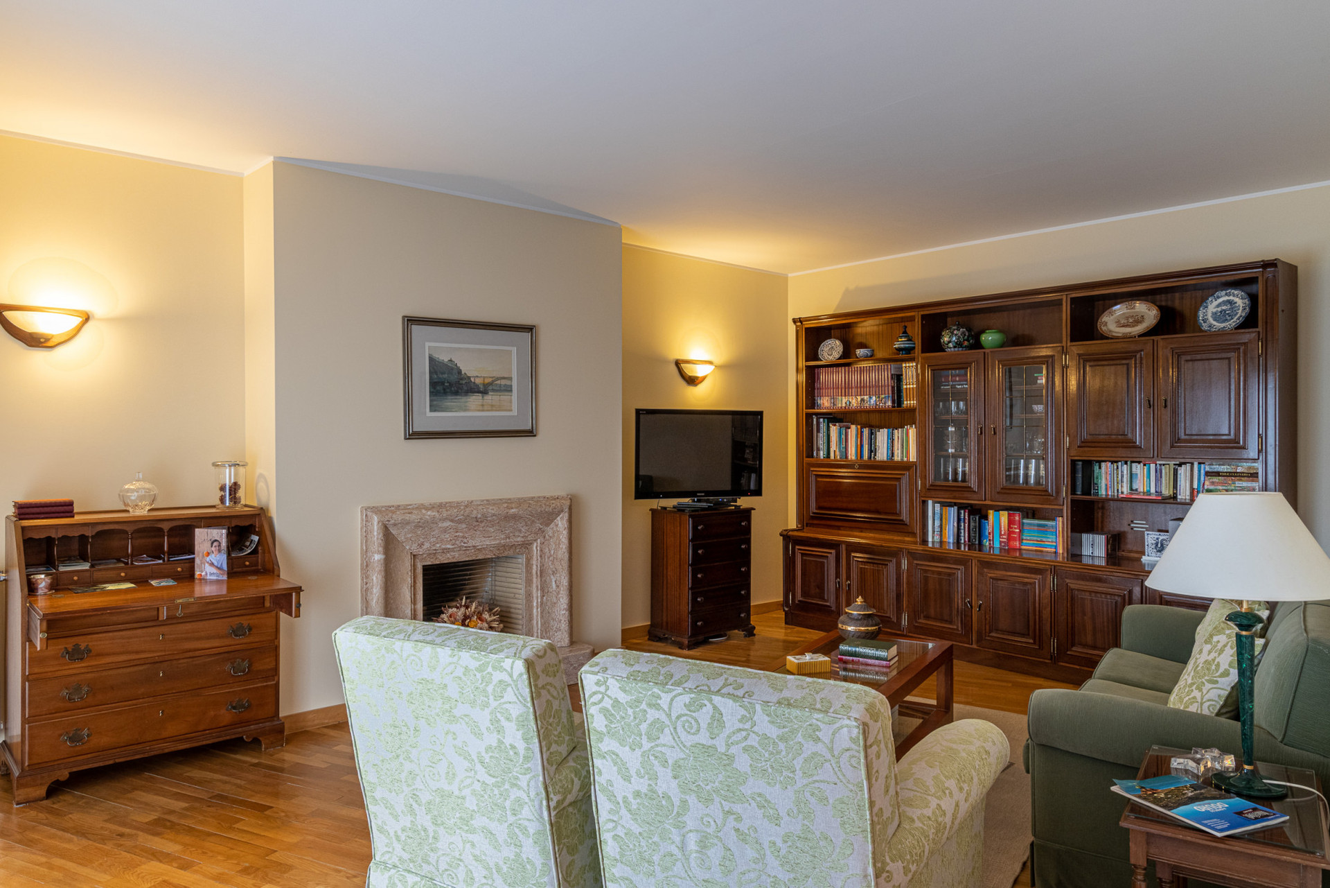 Living room with fireplace and bookcase
