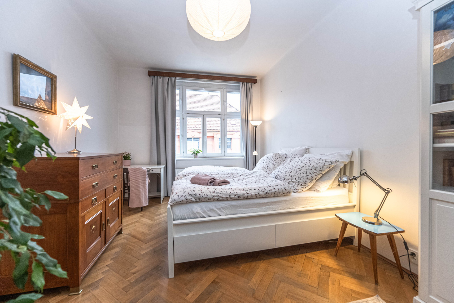 Bright bedroom with parquet floor