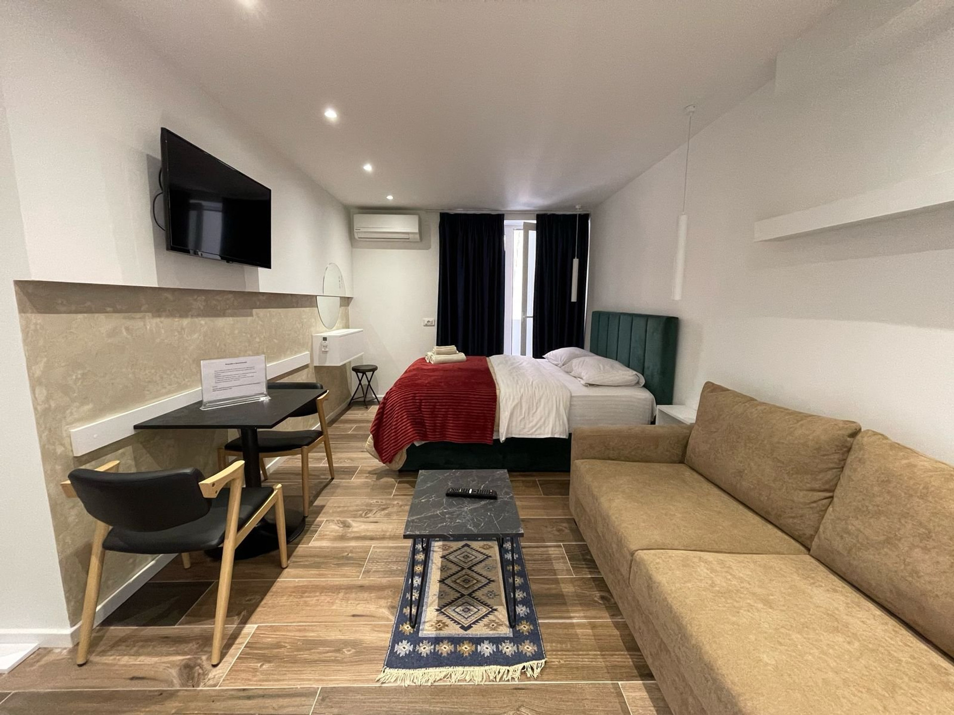 Open studio with sofa and bed
