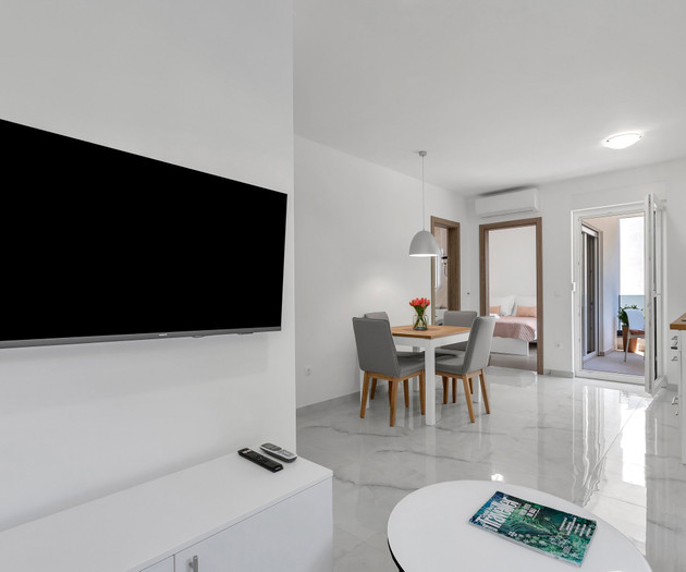 Living room with TV and dining