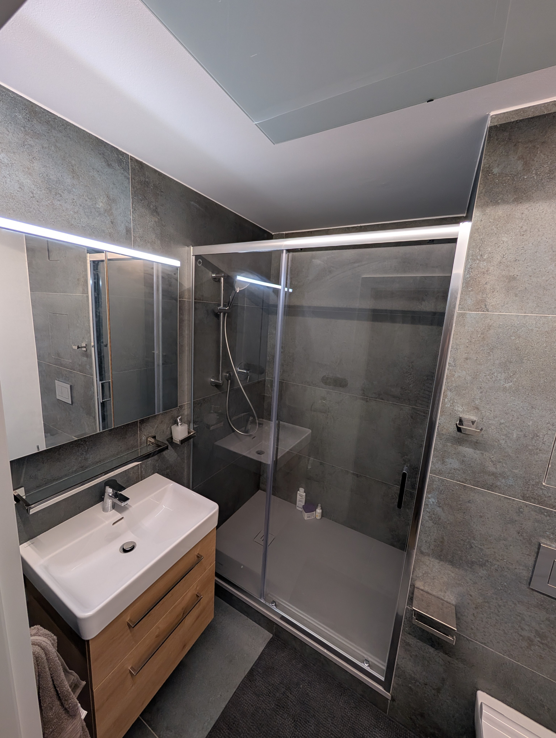 Bathroom with glass shower and vanity