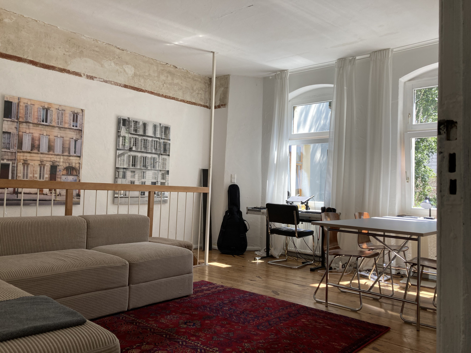 Bright living room with couch, carpet, table, etc!