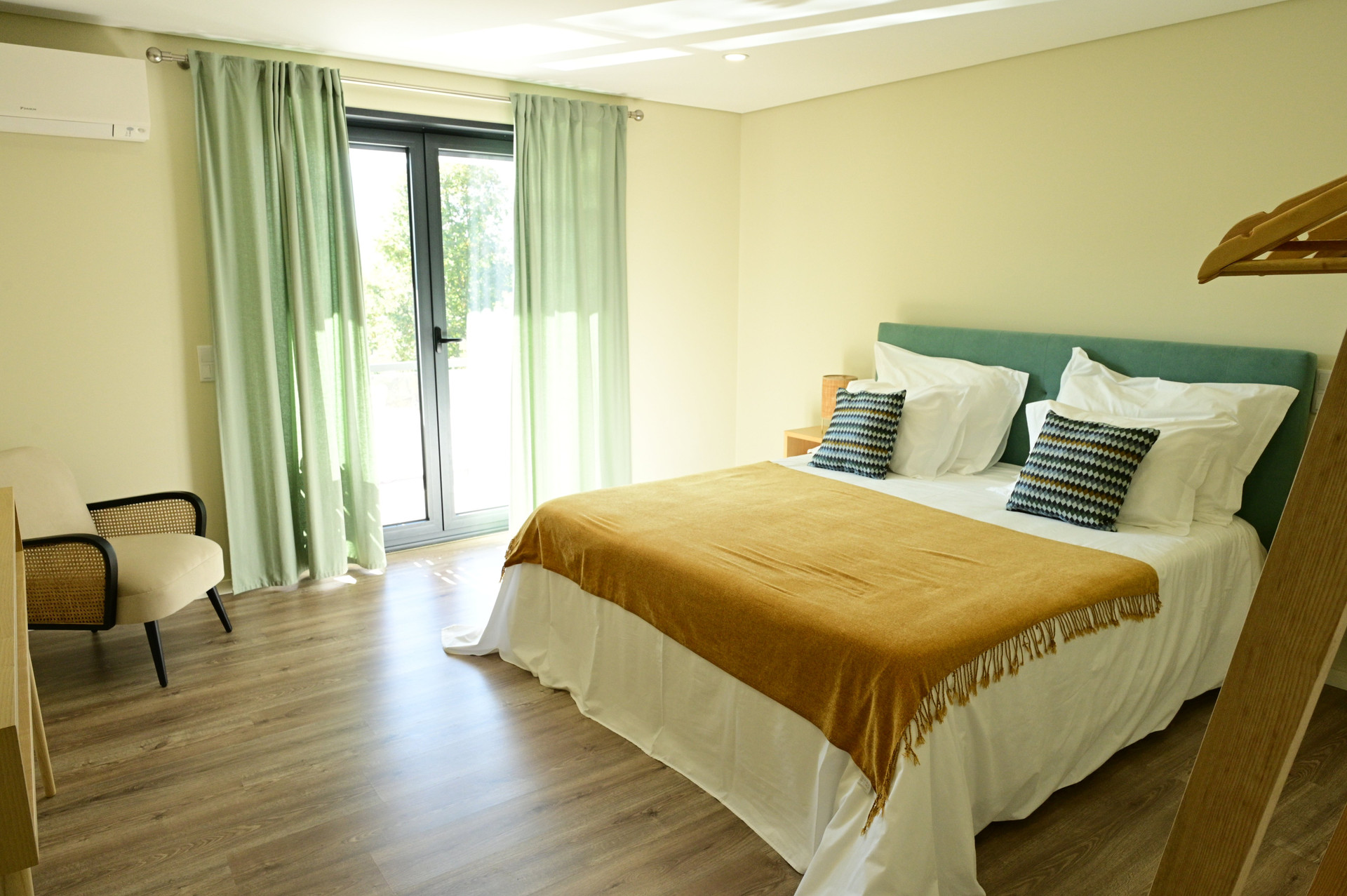 Bedroom with double bed and balcony door
