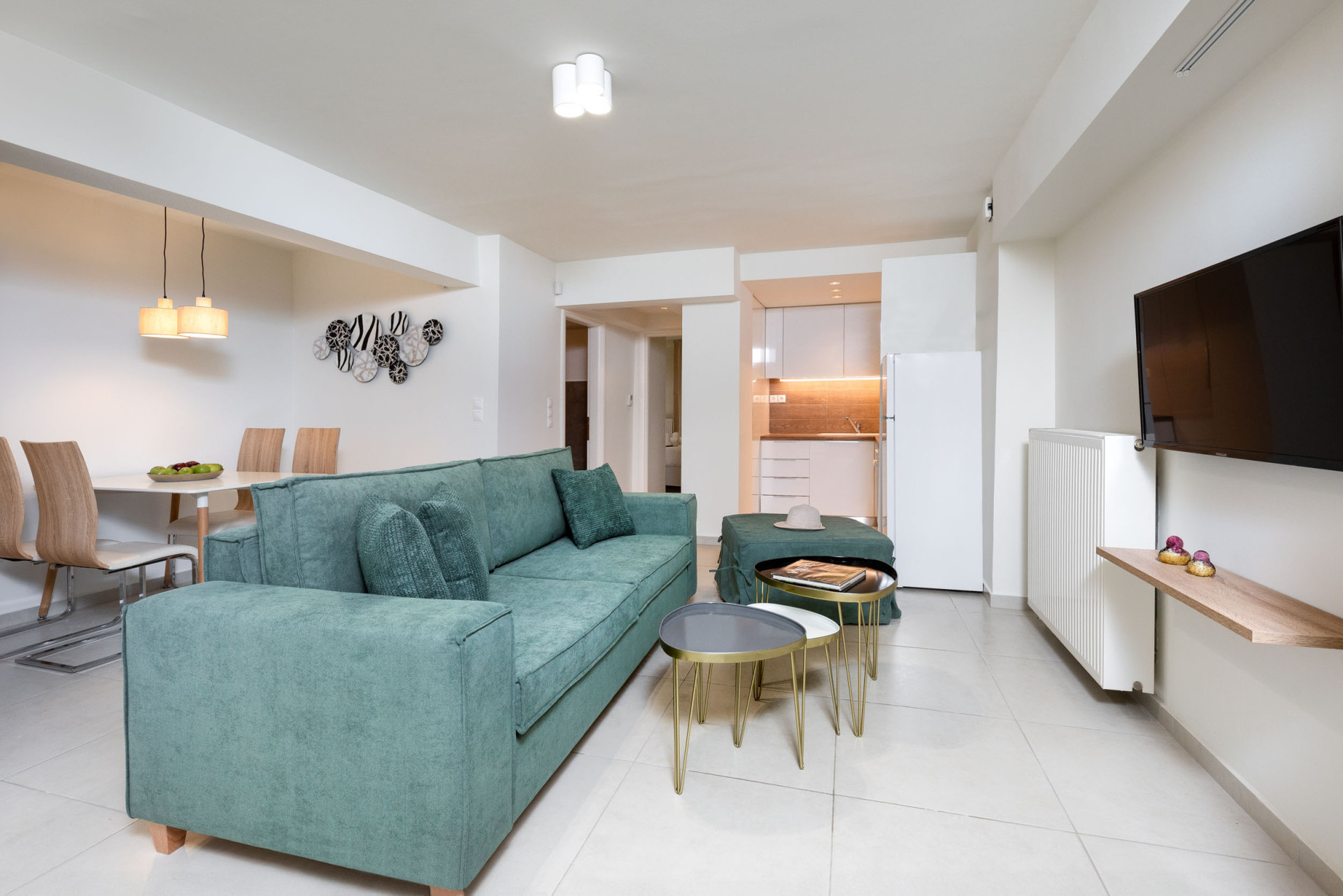 Living room with comfortable Sofa and Flat-screen Smart TV.
