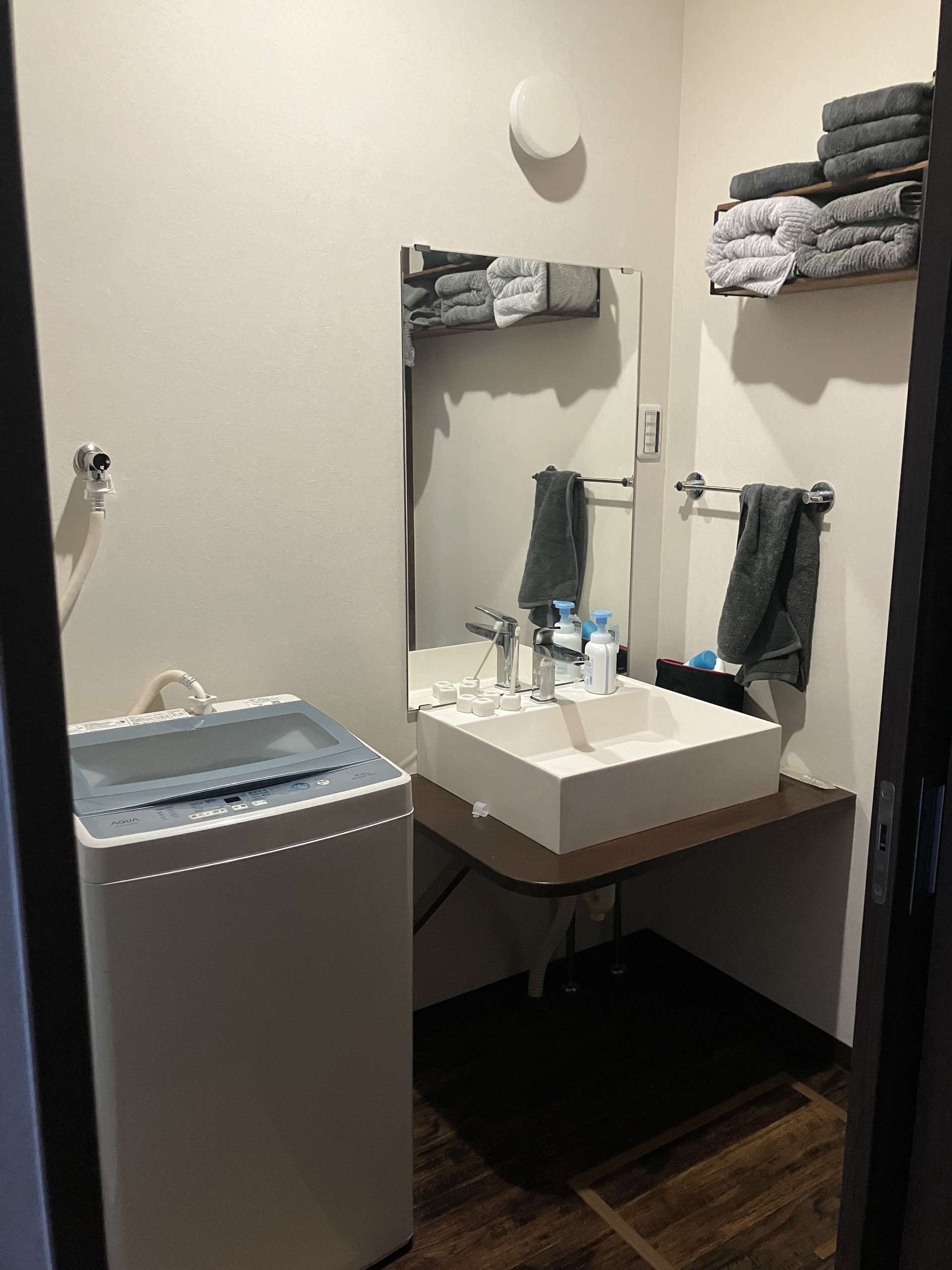 Bathroom vanity with sink and washer