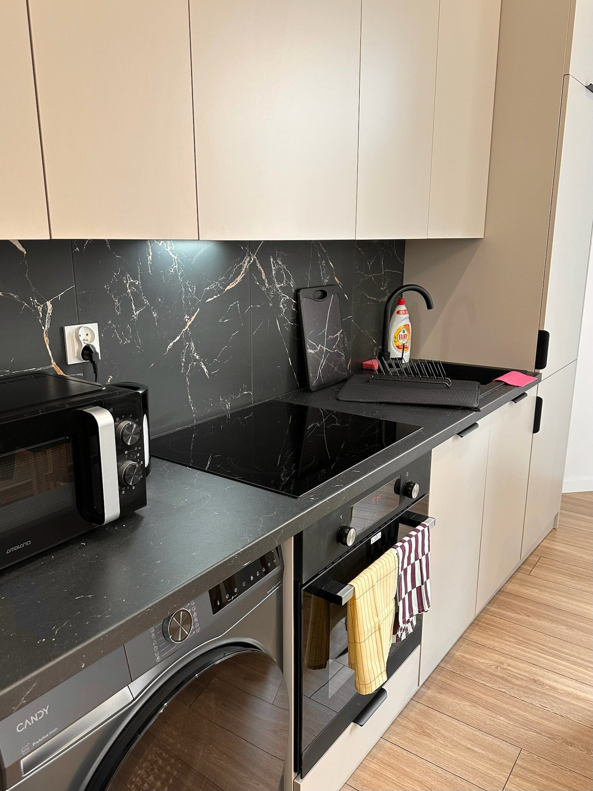 Kitchen counter with stove and sink