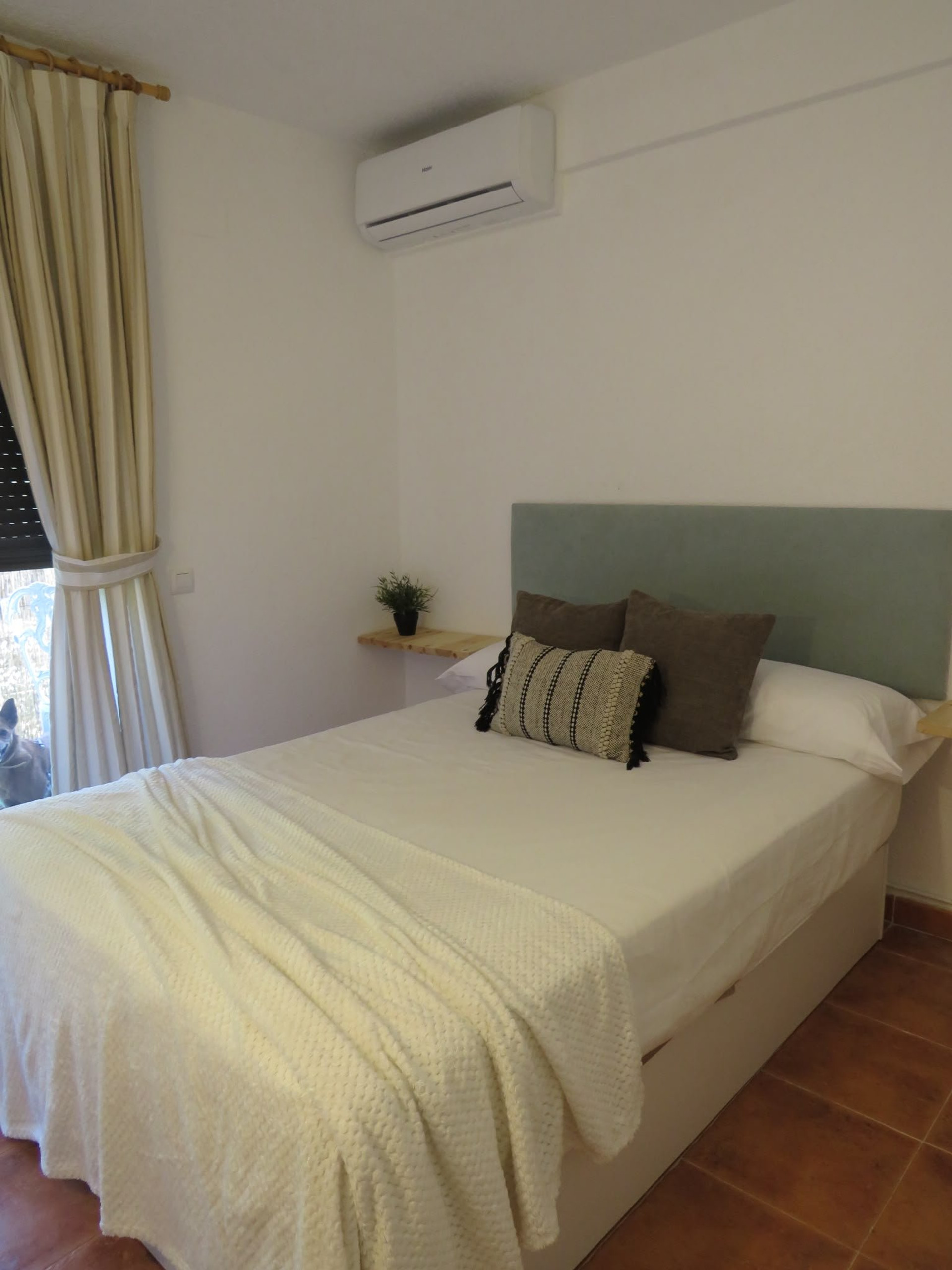 Double bedroom with green headboard