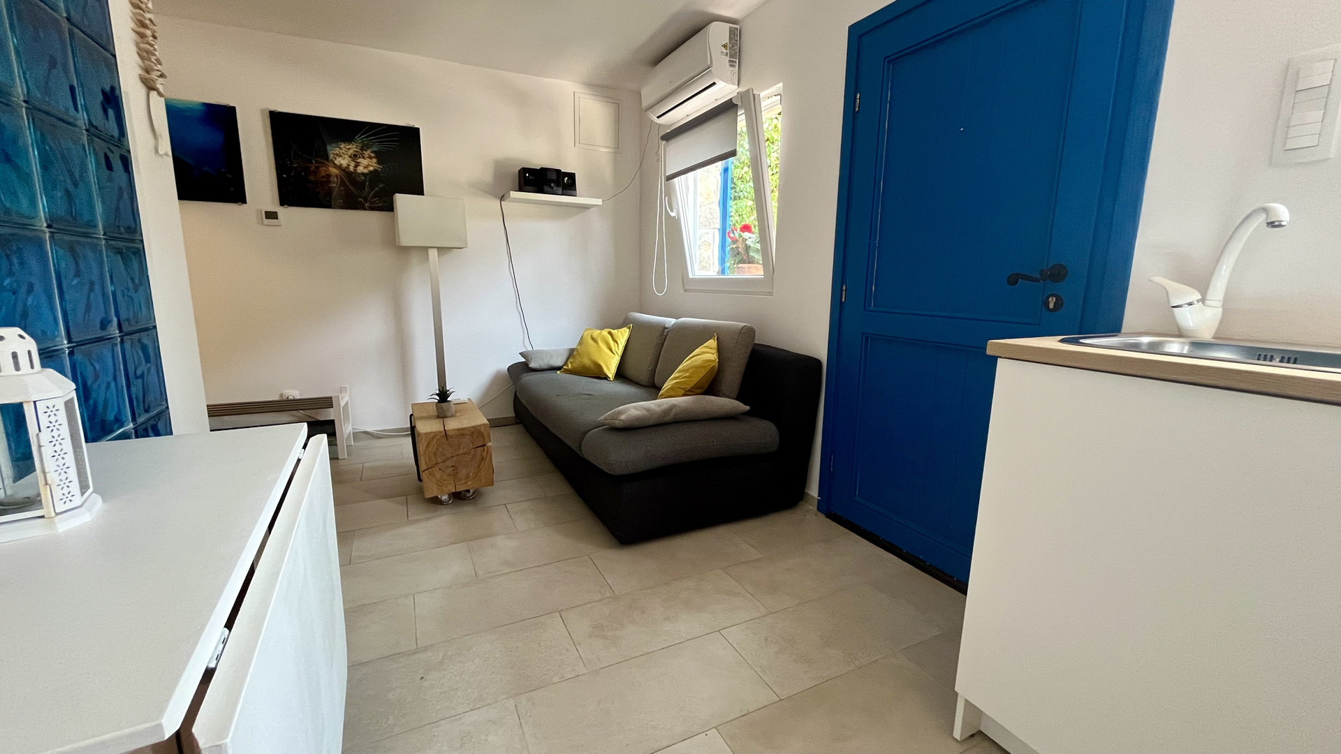 Living area with sofa and blue door
