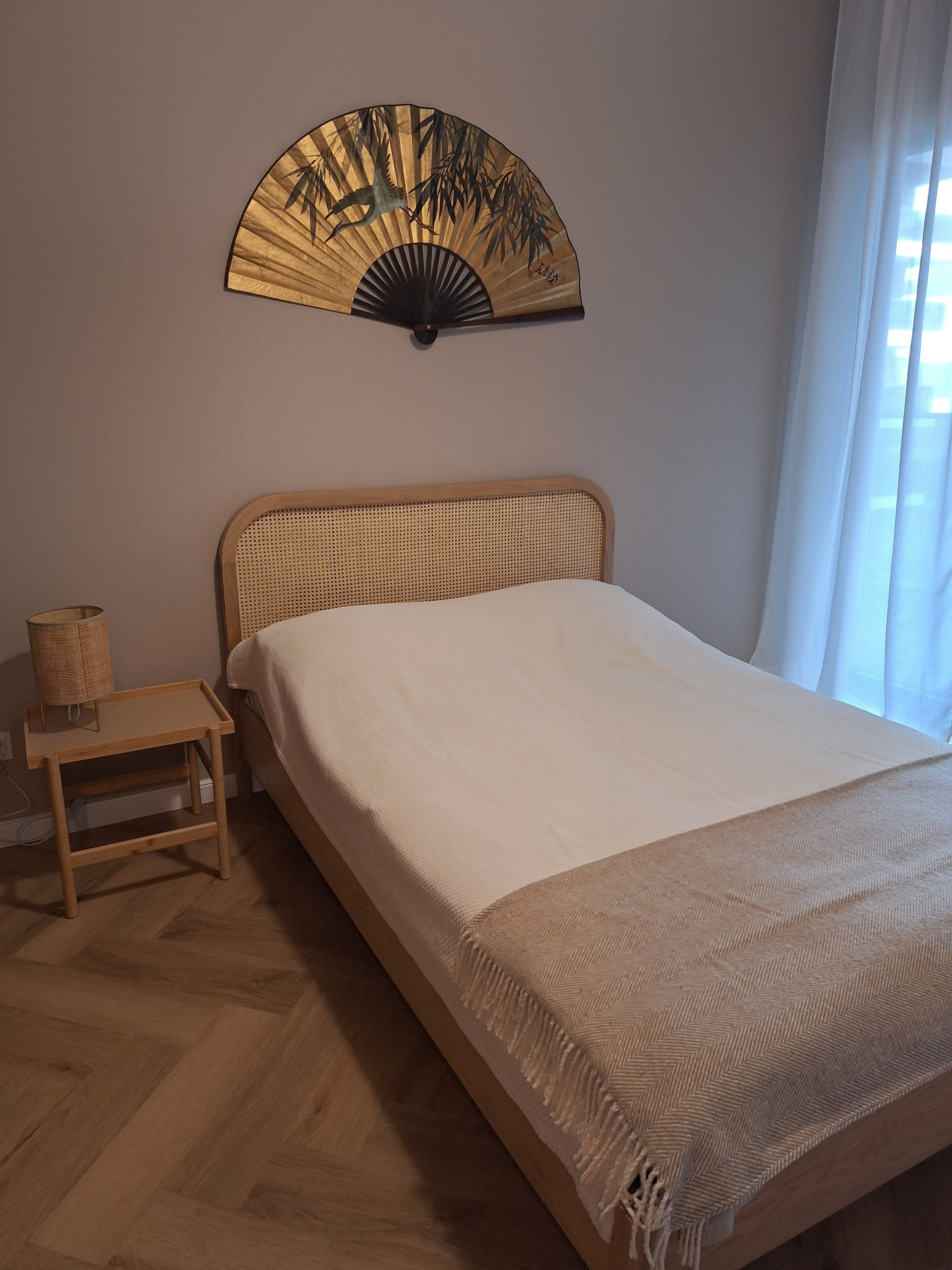 Bedroom with rattan headboard bed