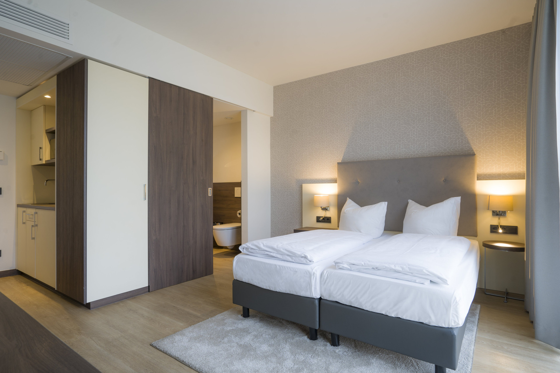 Studio bedroom with kitchenette view