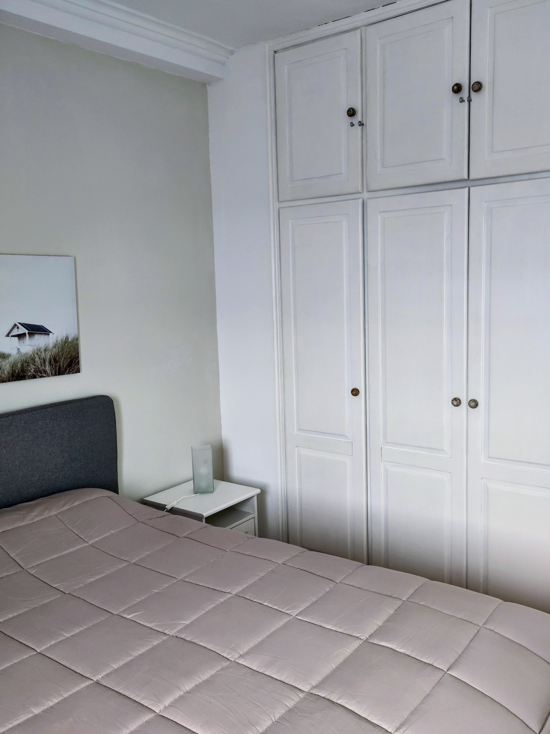 Bedroom with wardrobe and bed