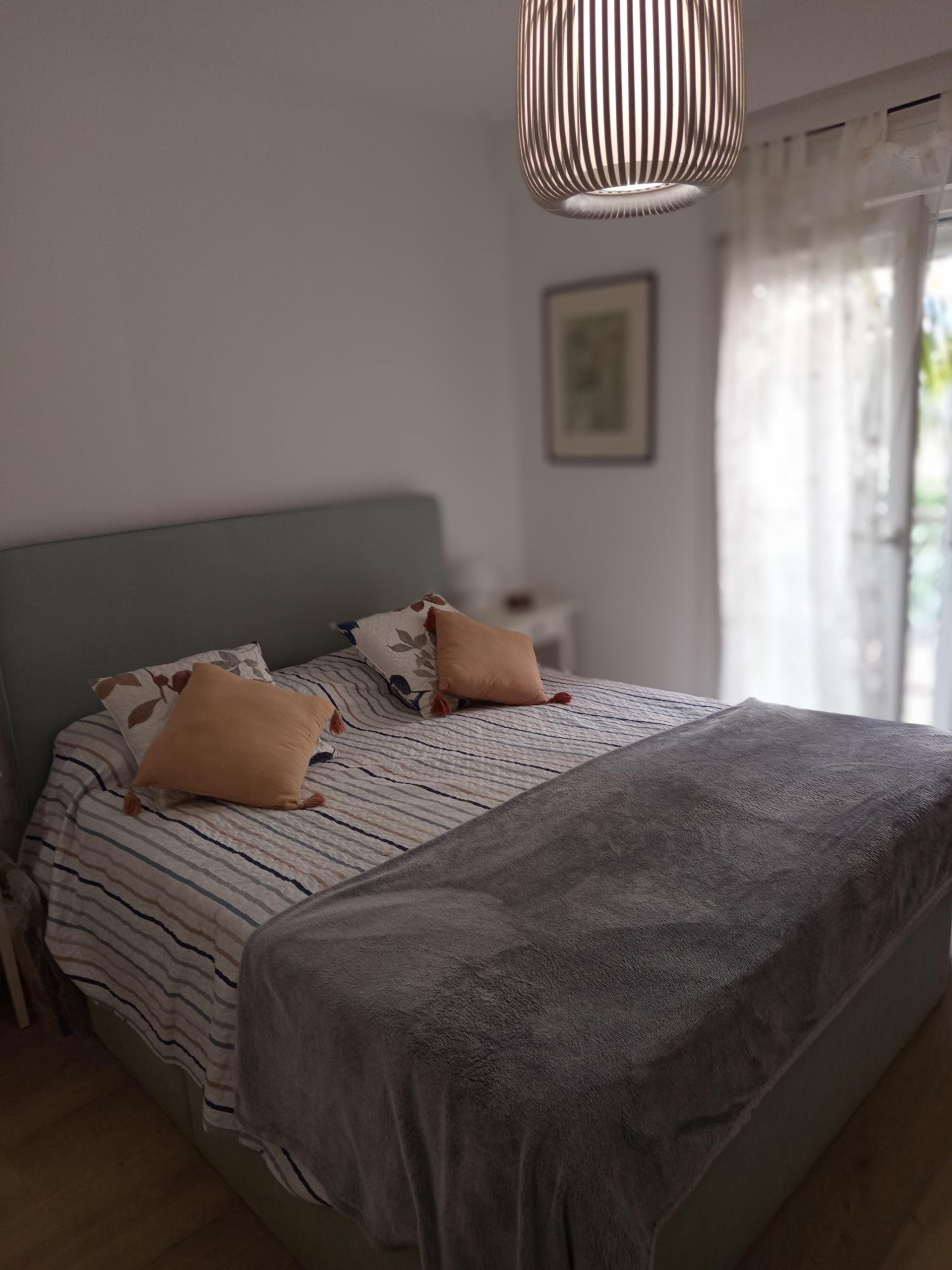 Master bedroom double bed bright window