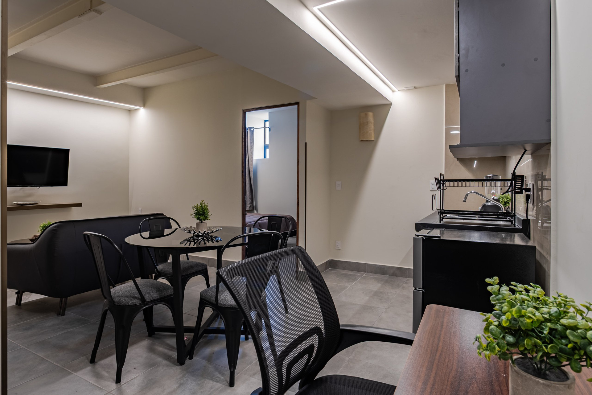Living area with dining table and kitchenette