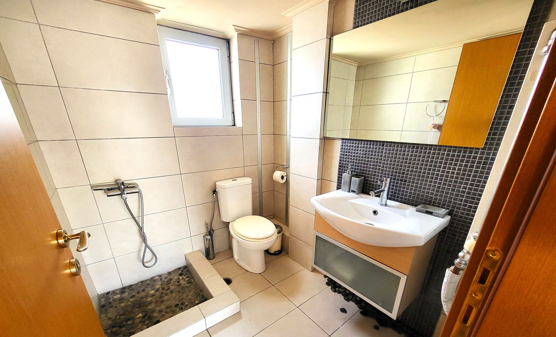 Bathroom with shower and sink