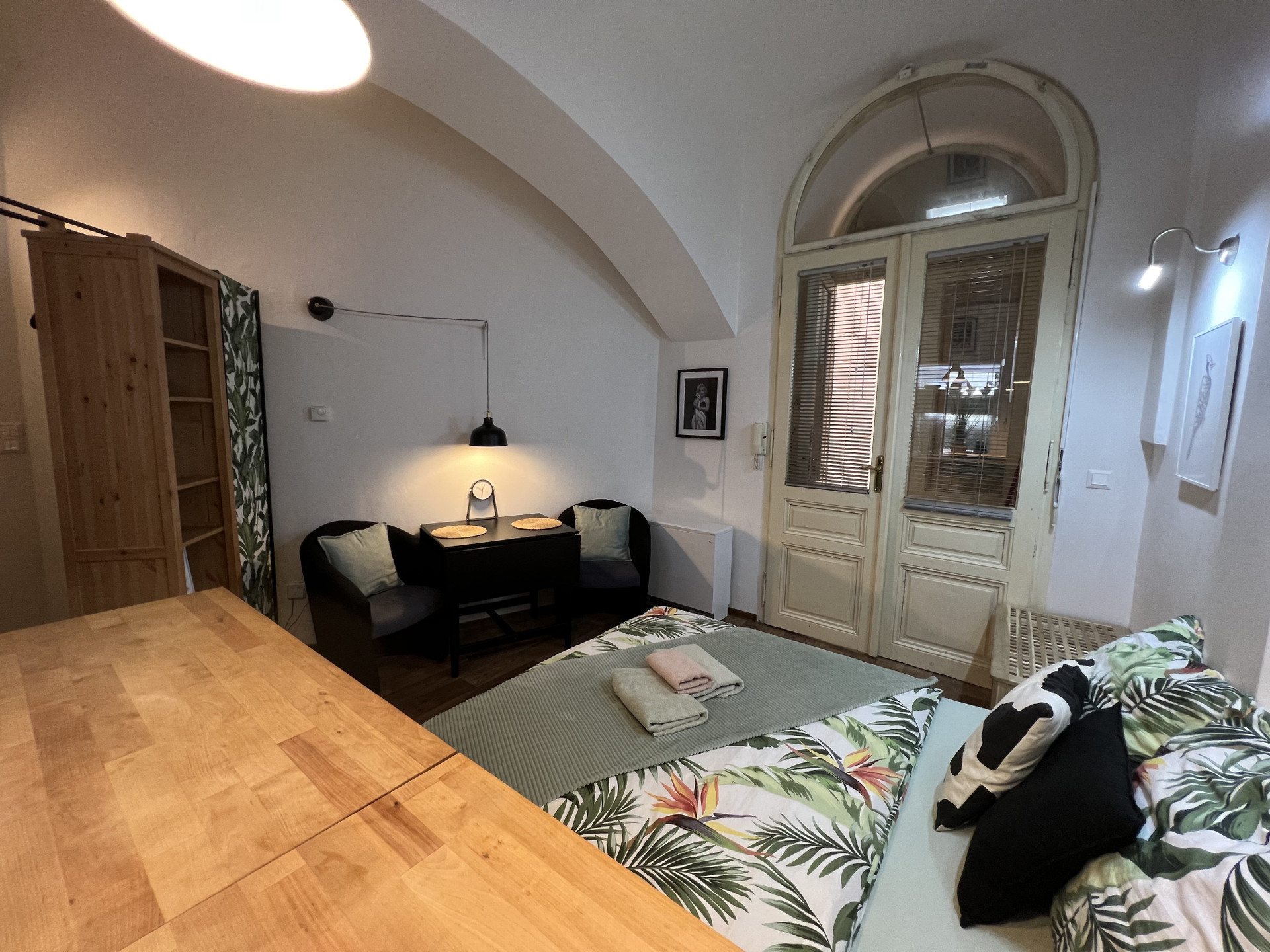 Studio with arched window and seating