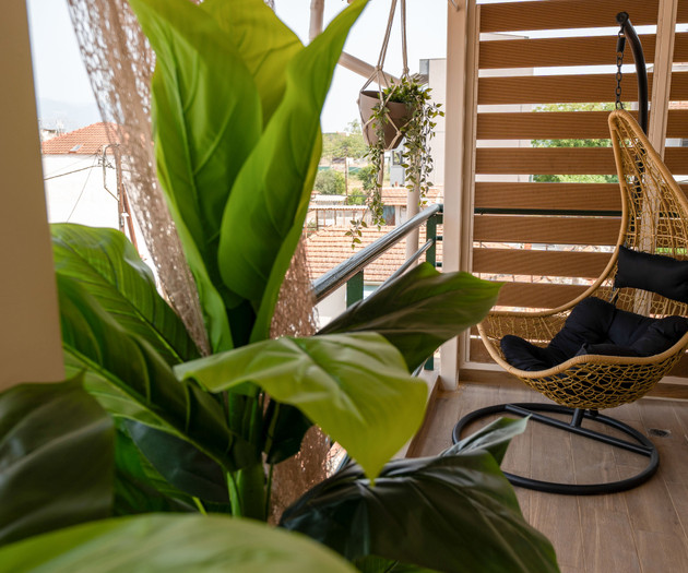 Hanging egg chair on balcony