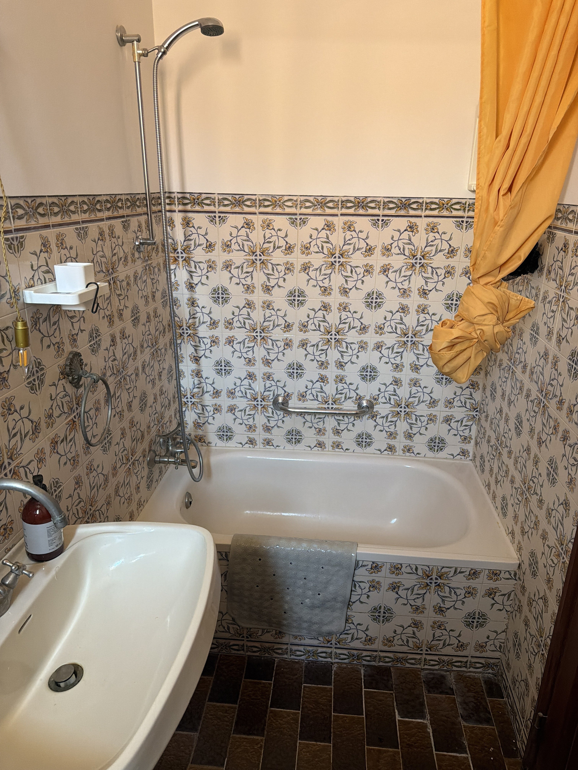 Bathroom with tiled walls, tub