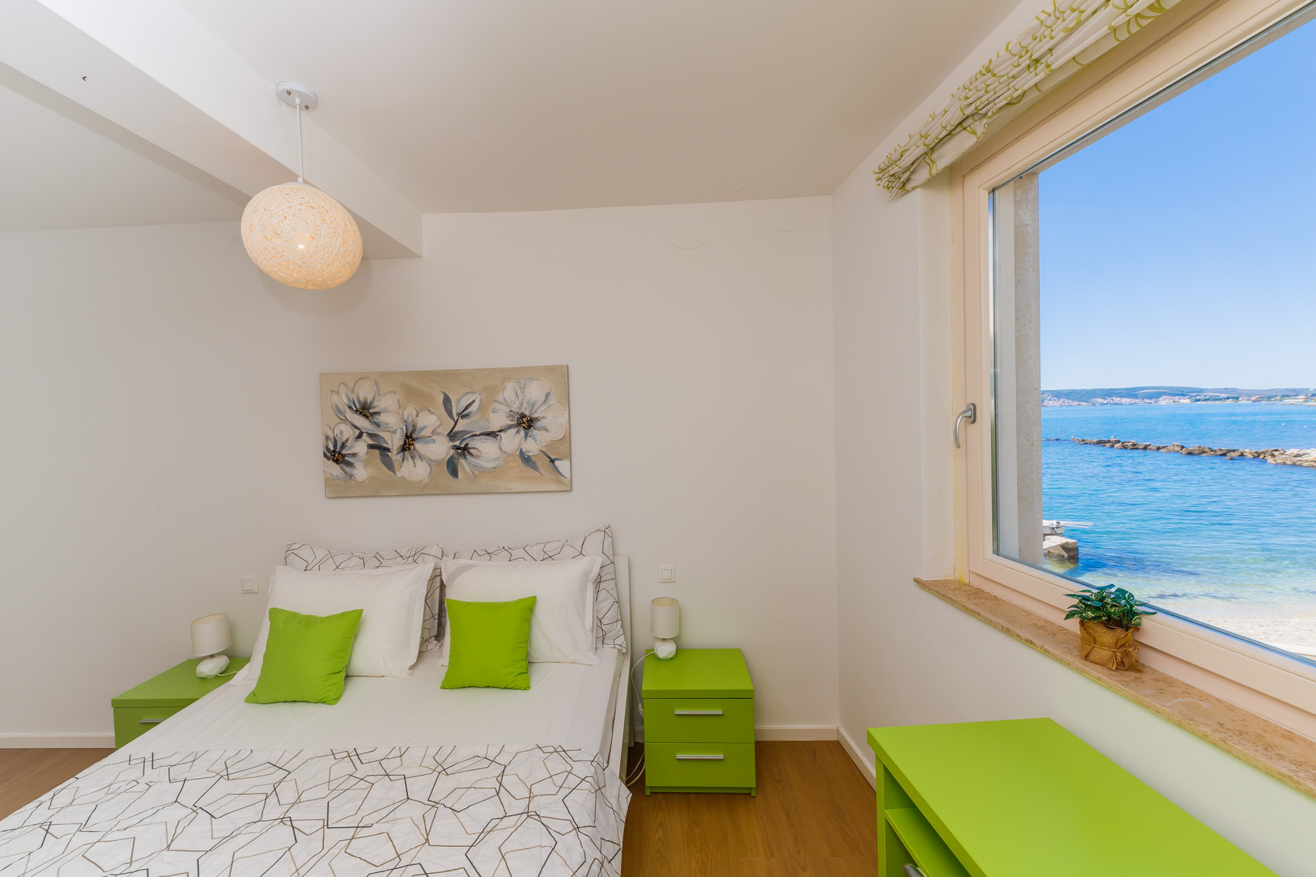 bedroom with balcony and beach view