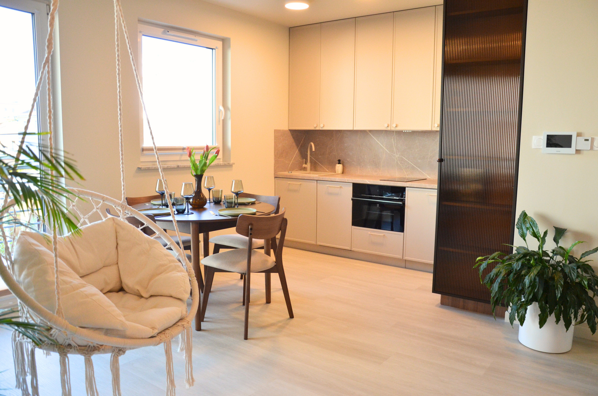 Open kitchen with hanging chair