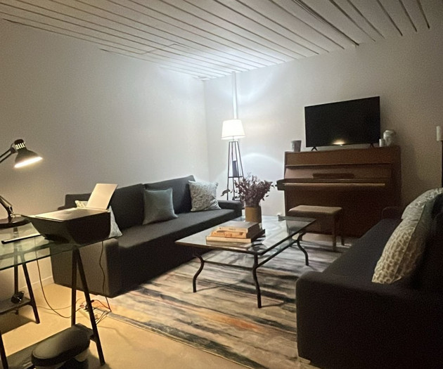 Lounge area with TV and piano