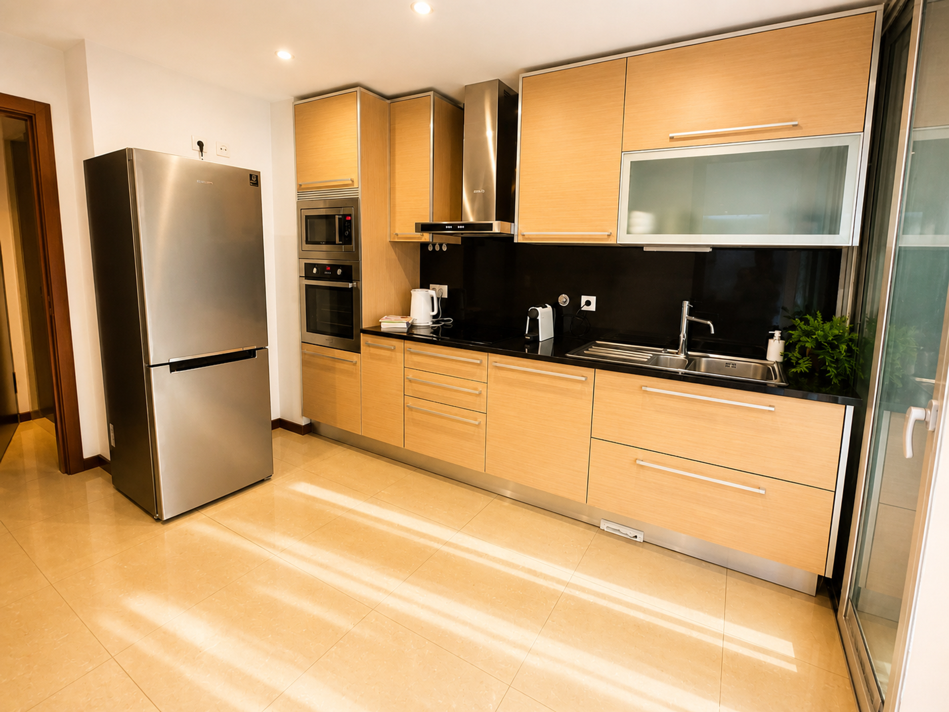 Full kitchen with fridge and cabinets