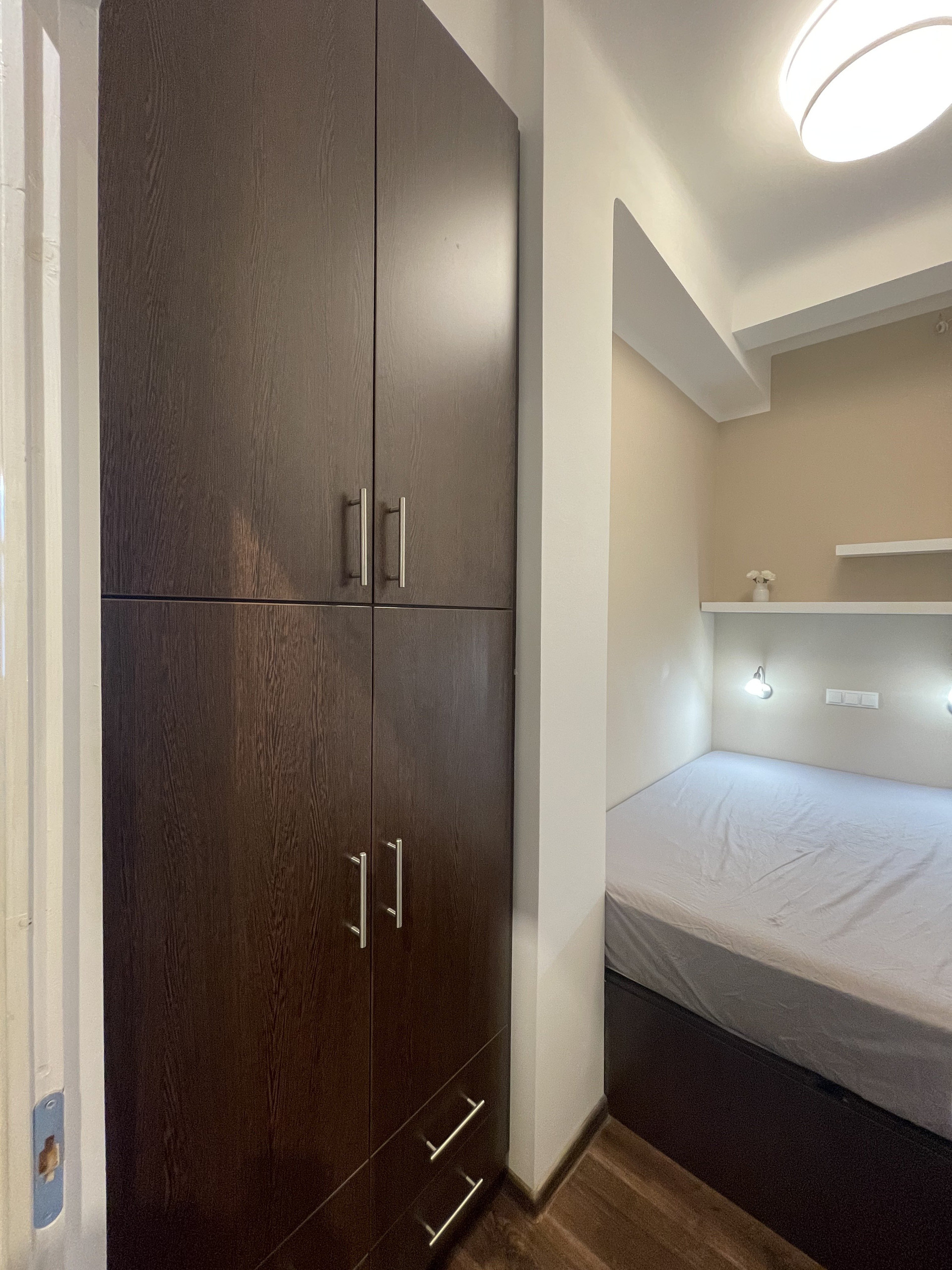 Bedroom with wardrobe and bed