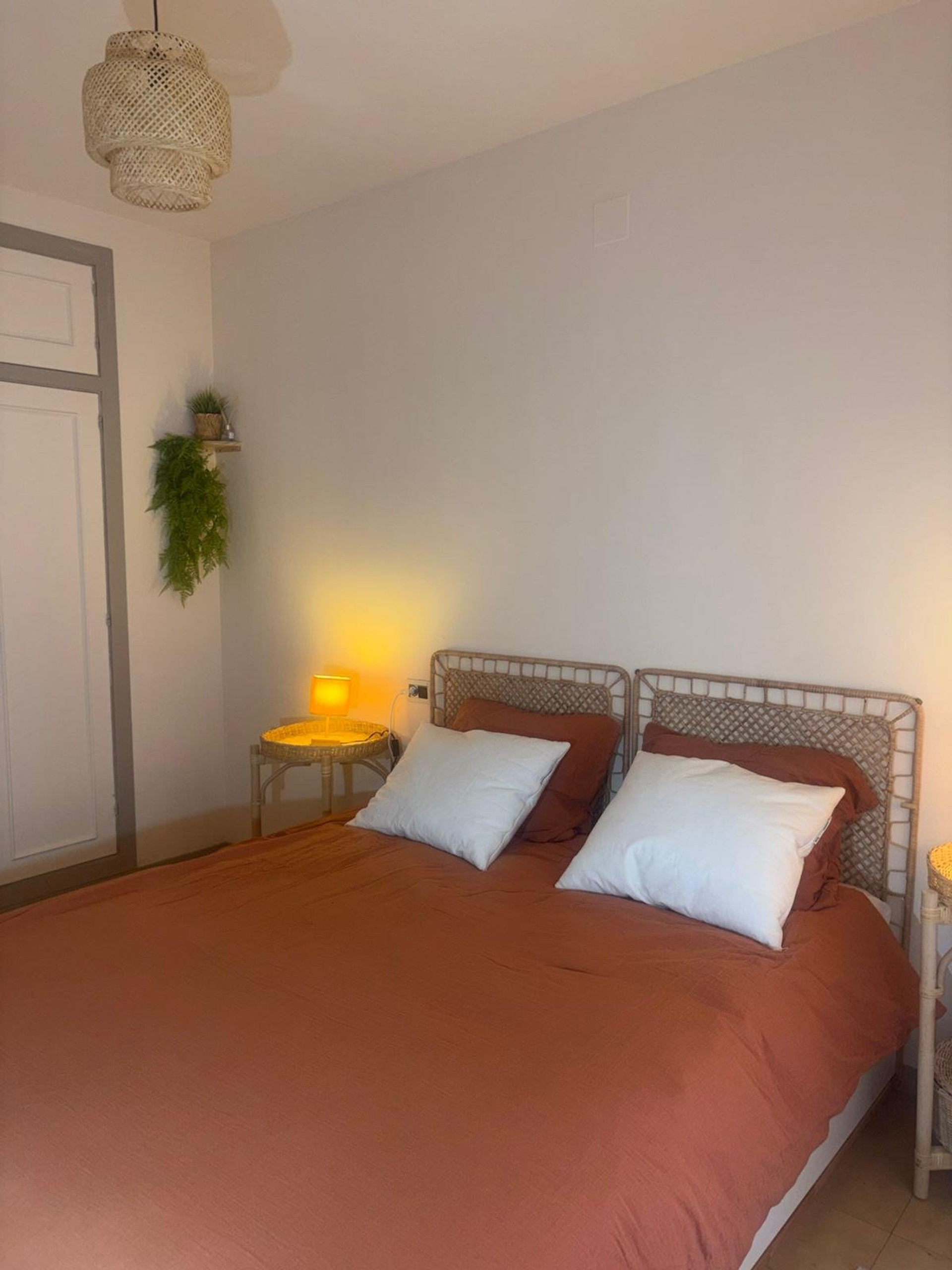 Cozy bedroom with rattan headboards