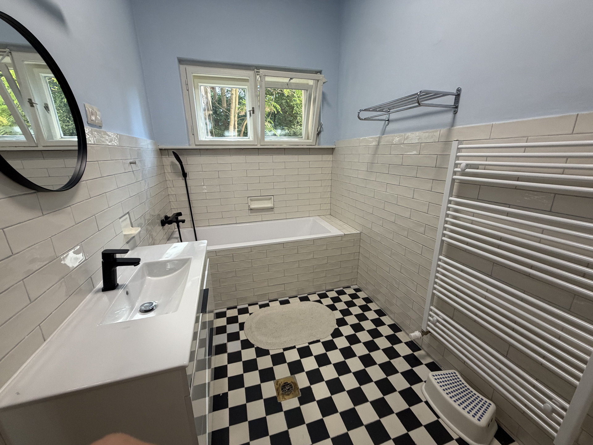 Bathroom with black-white tile floor