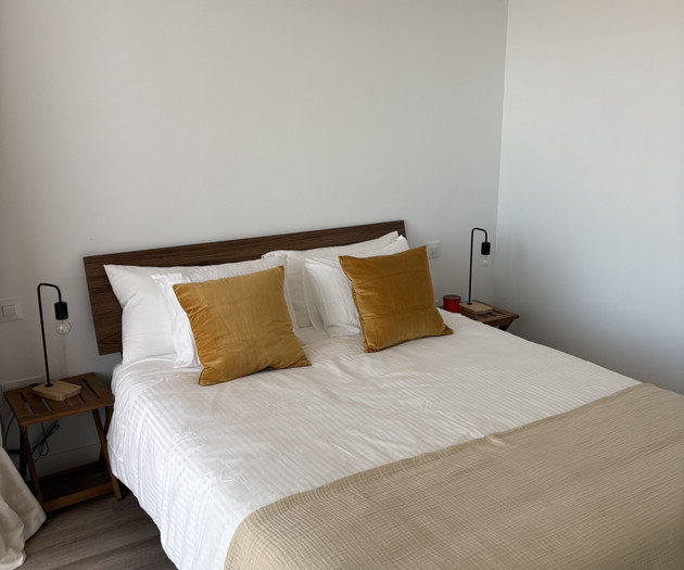 Bedroom bed with wooden headboard