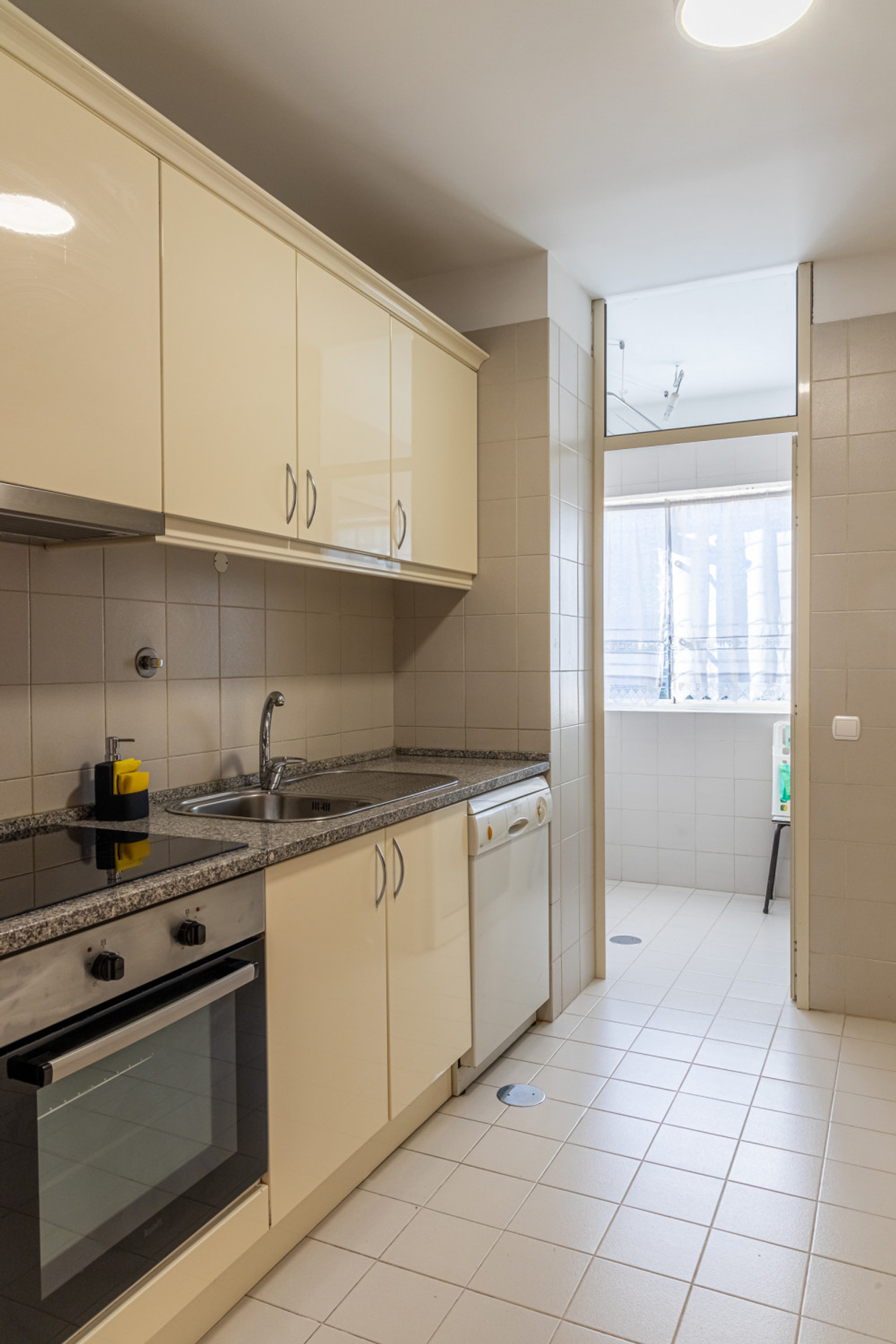 Kitchen with oven and laundry area
