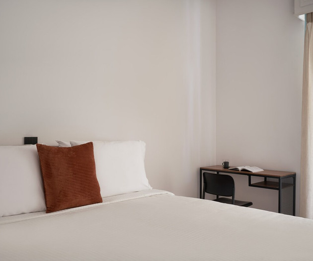 The first bedroom and its office desk