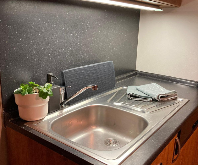 Kitchen sink with under-cabinet light